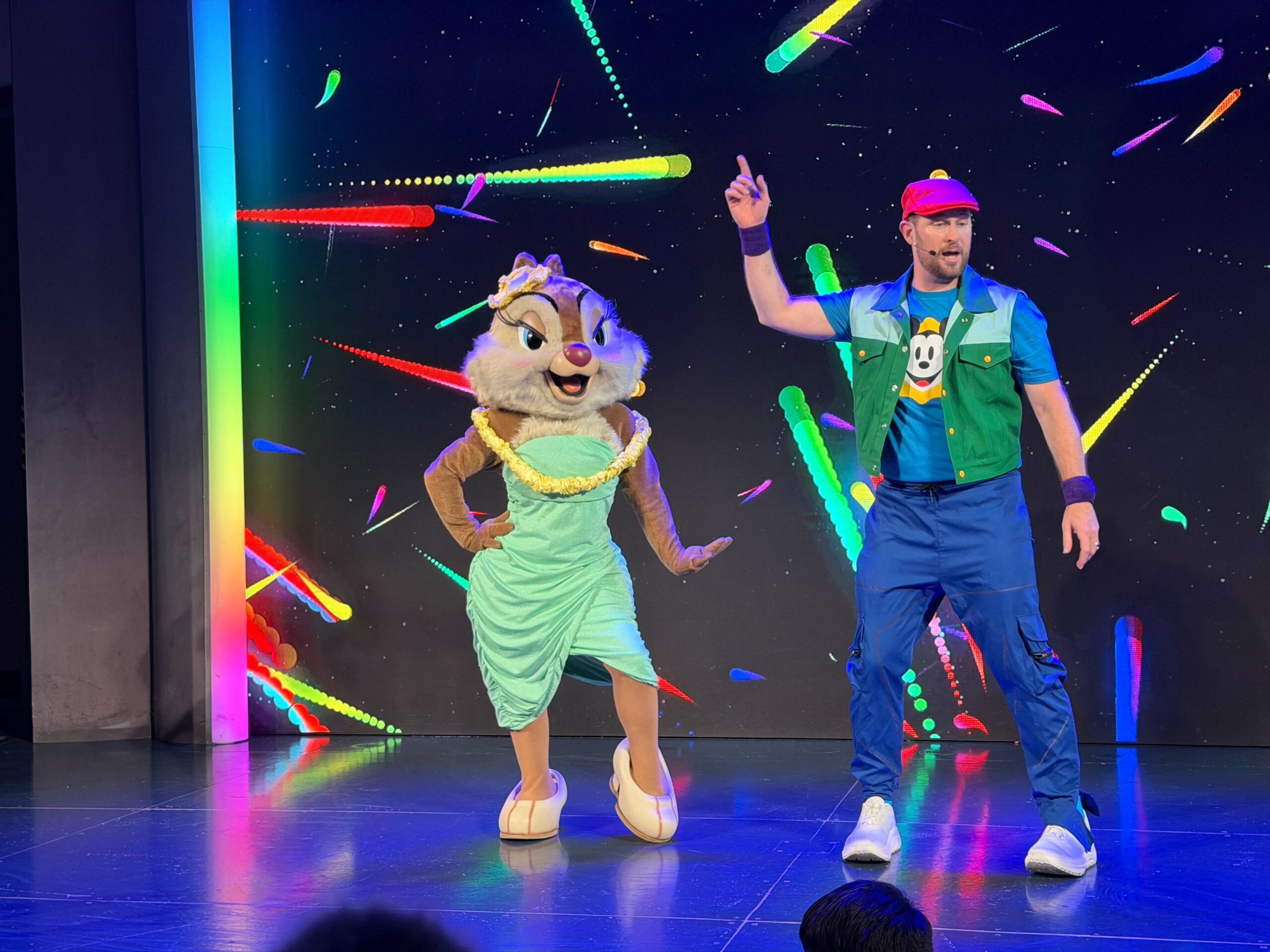 This is a free-flowing dance party with characters coming in and out. Guests can enter and exit at any time. A host teaches dances throughout the night.