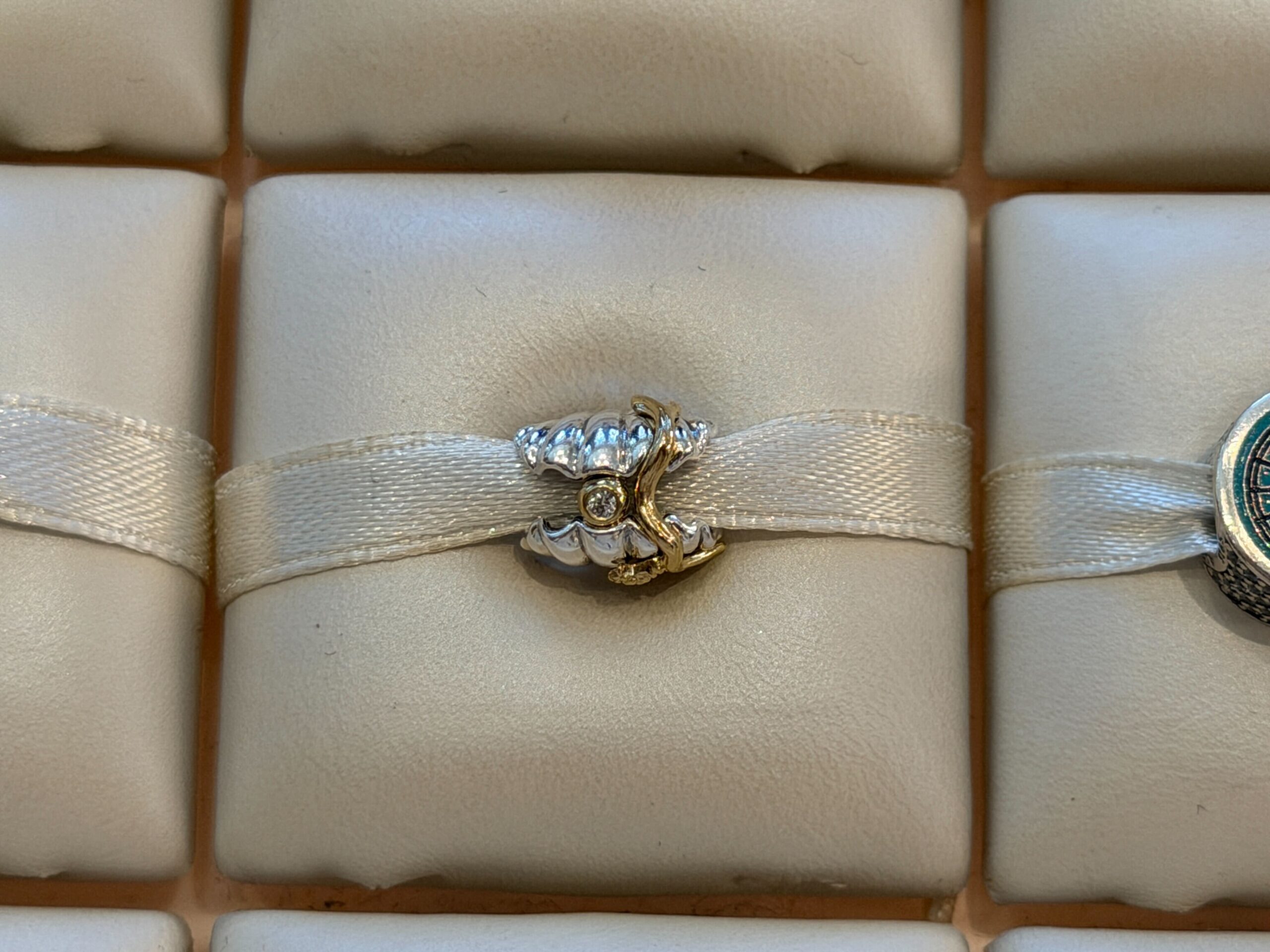 Back of Pandora Ariel with Diamond Shell Charm.