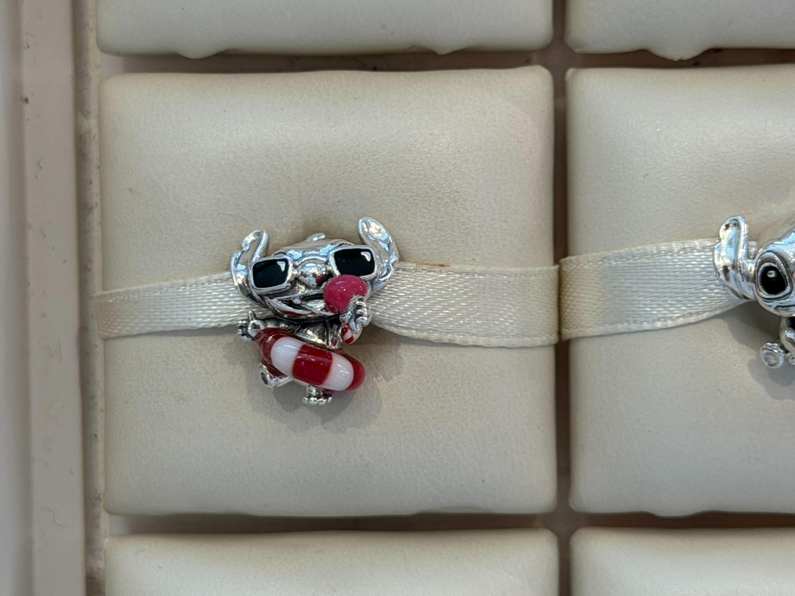 Front of Pandora Summer Stitch Charm.
