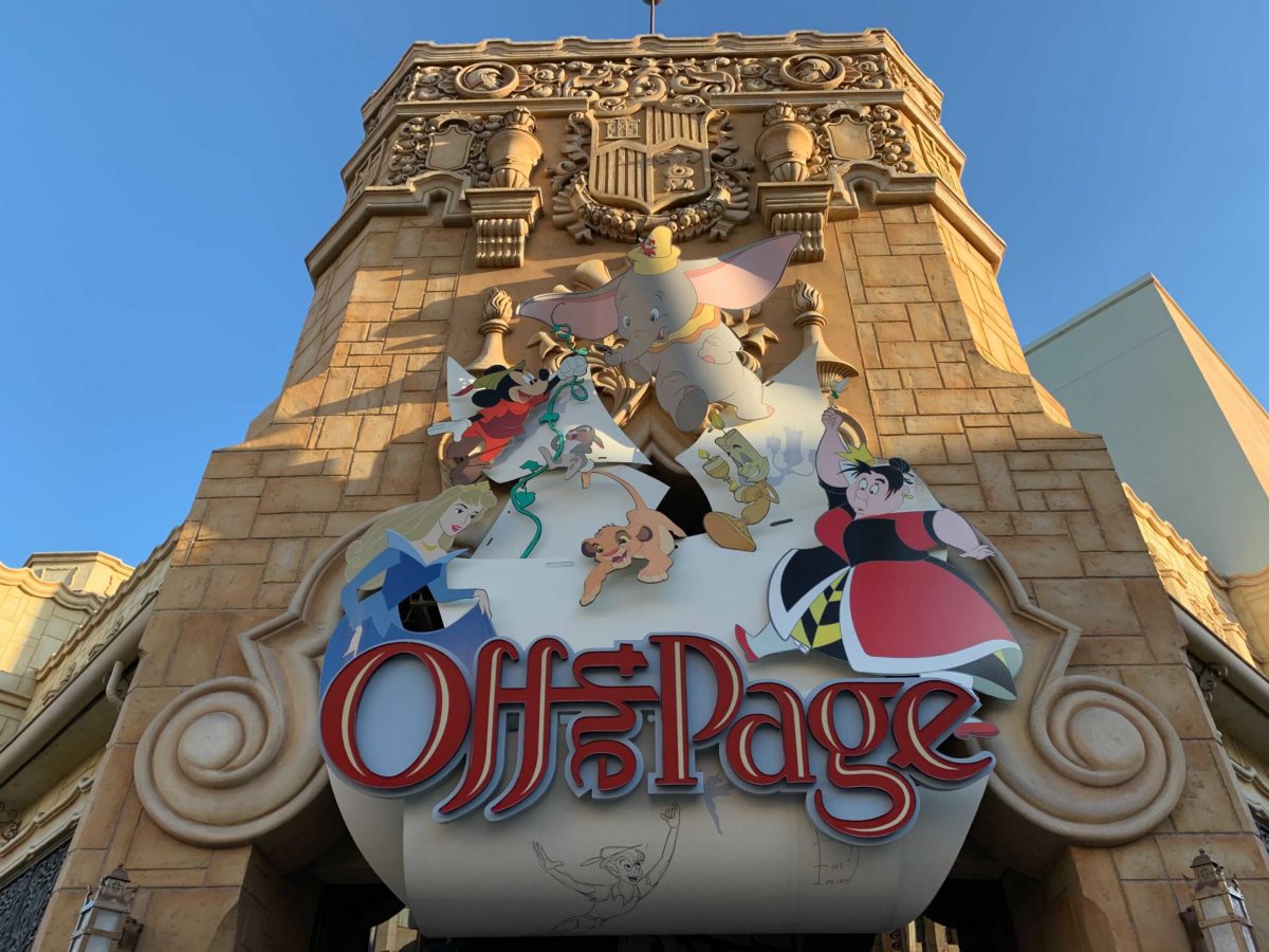 Off the Page shop facade in Disney California Adventure featuring characters like Dumbo, Simba, Queen of Hearts, and more.