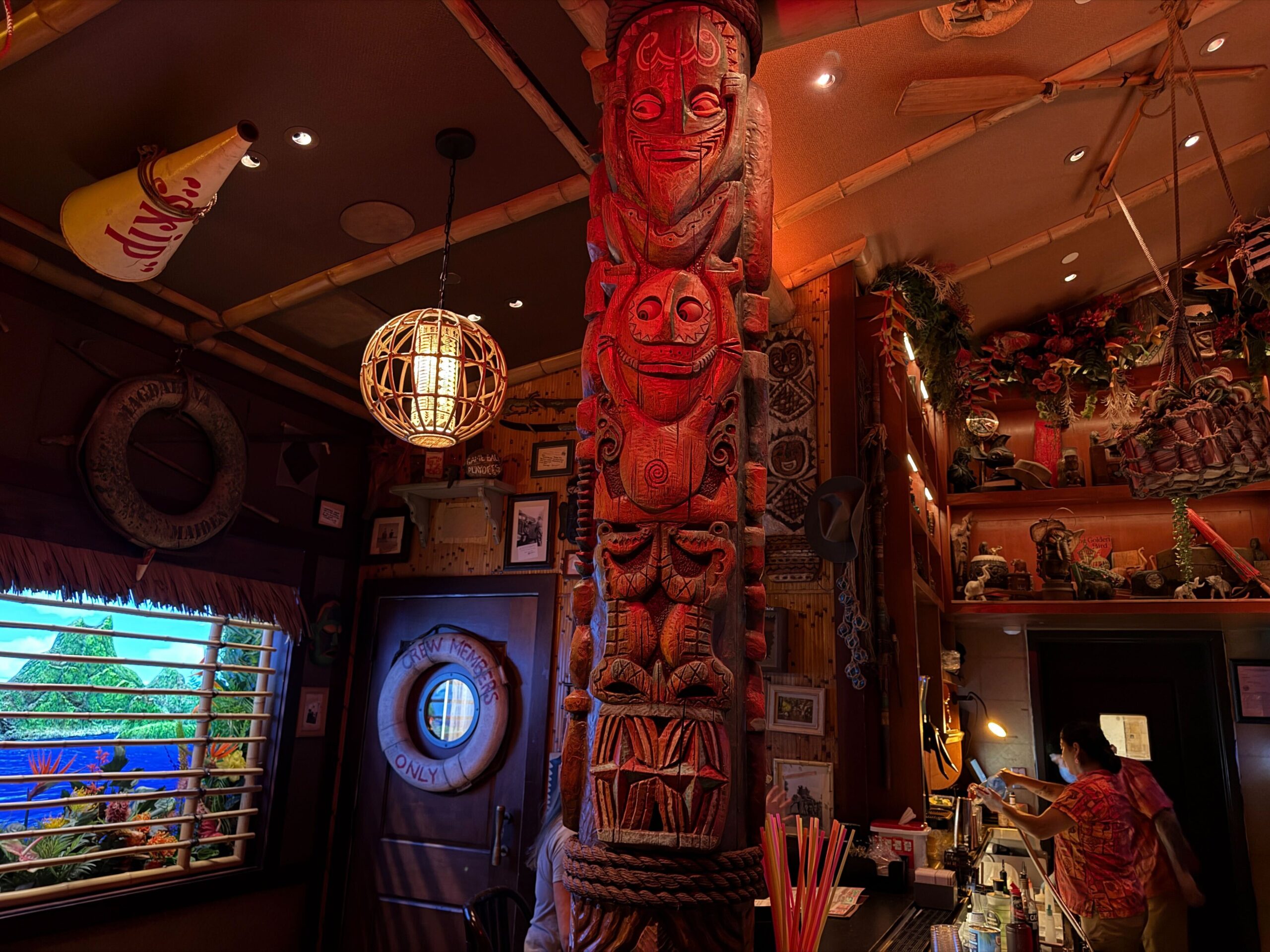 Disneyland Hotel Trader Sam's tiki bar totem poles.
