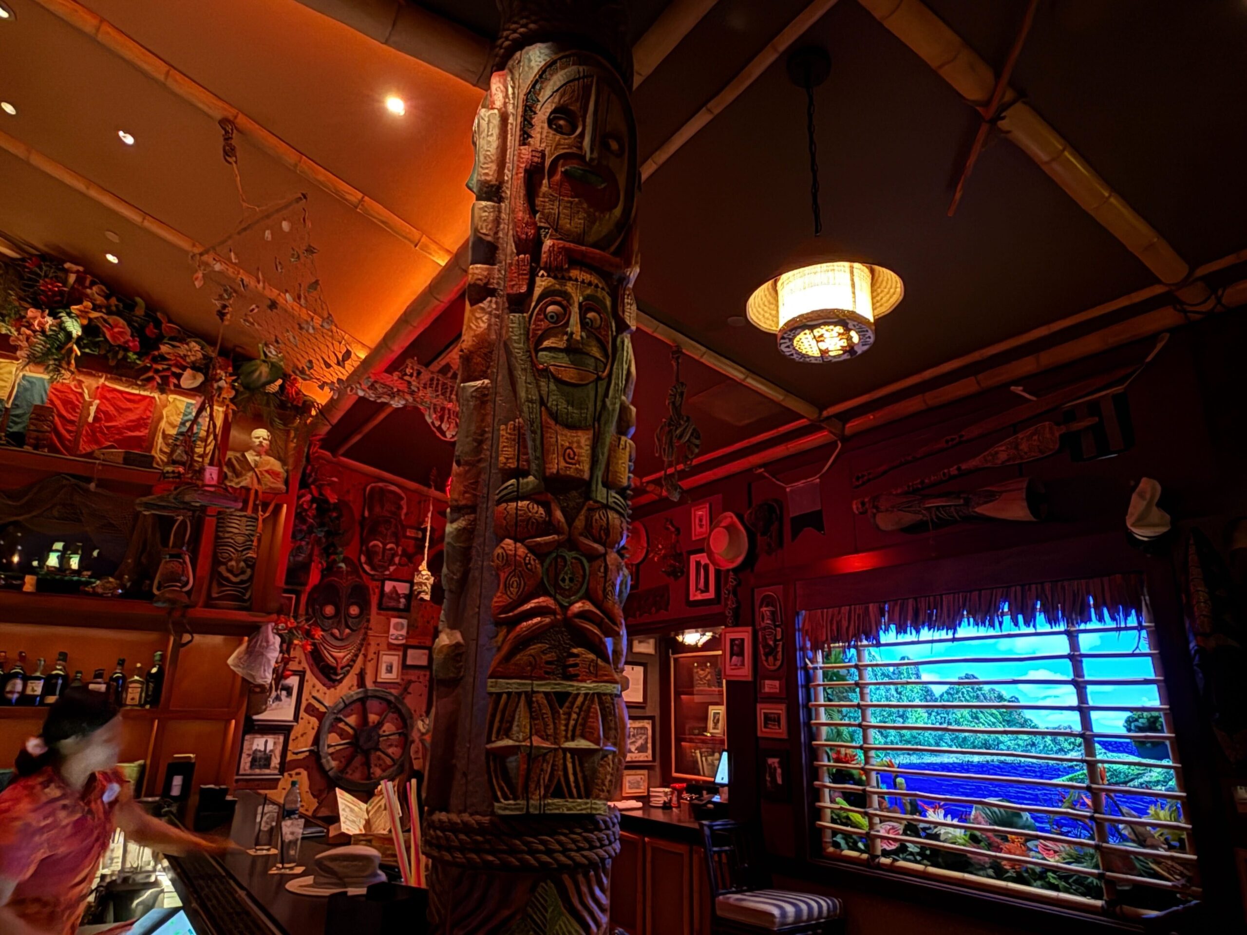 Disneyland Hotel Trader Sam's tiki bar totem poles.