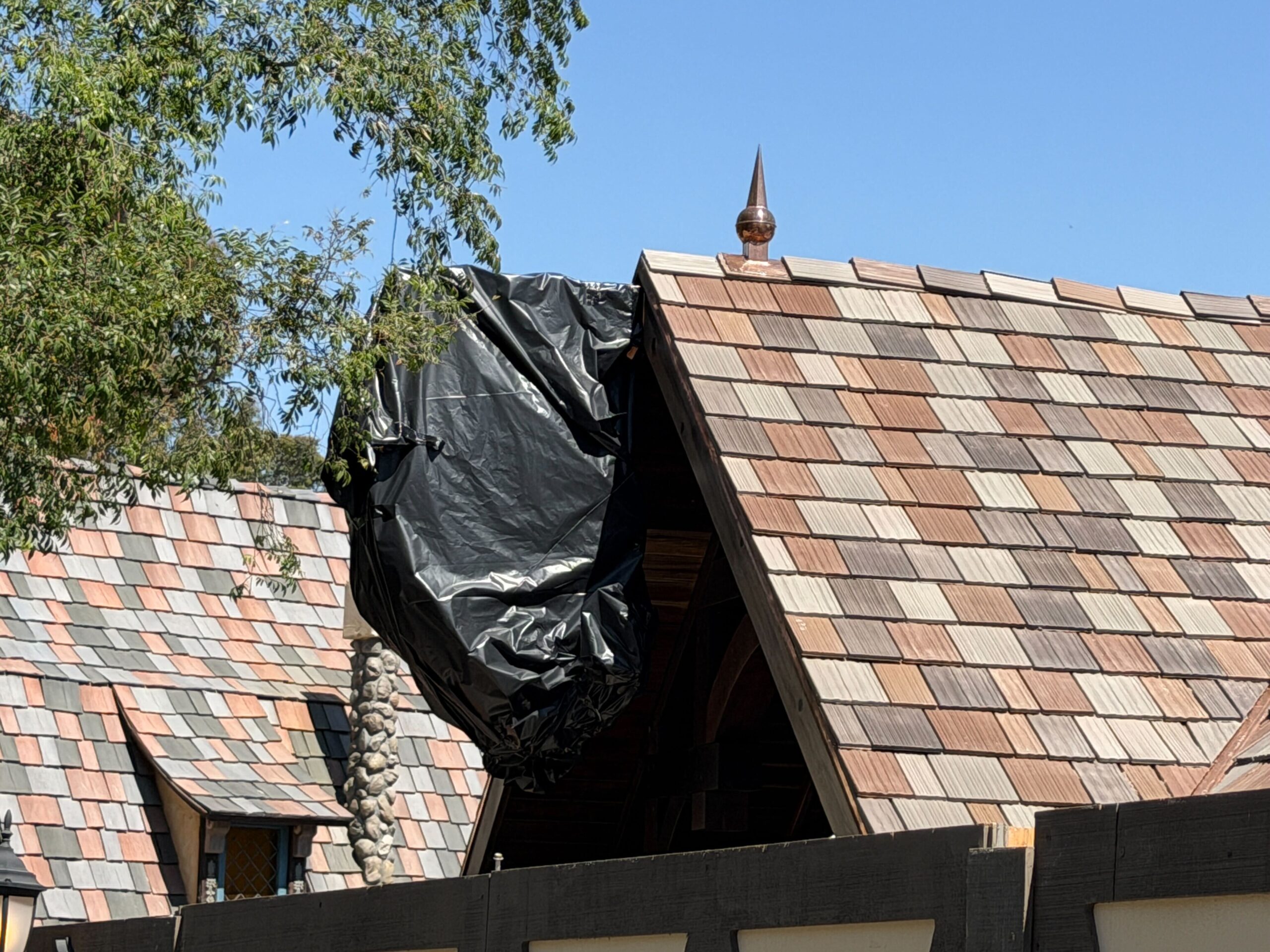In addition, a black tarp covers what is likely an exterior sign for the building.