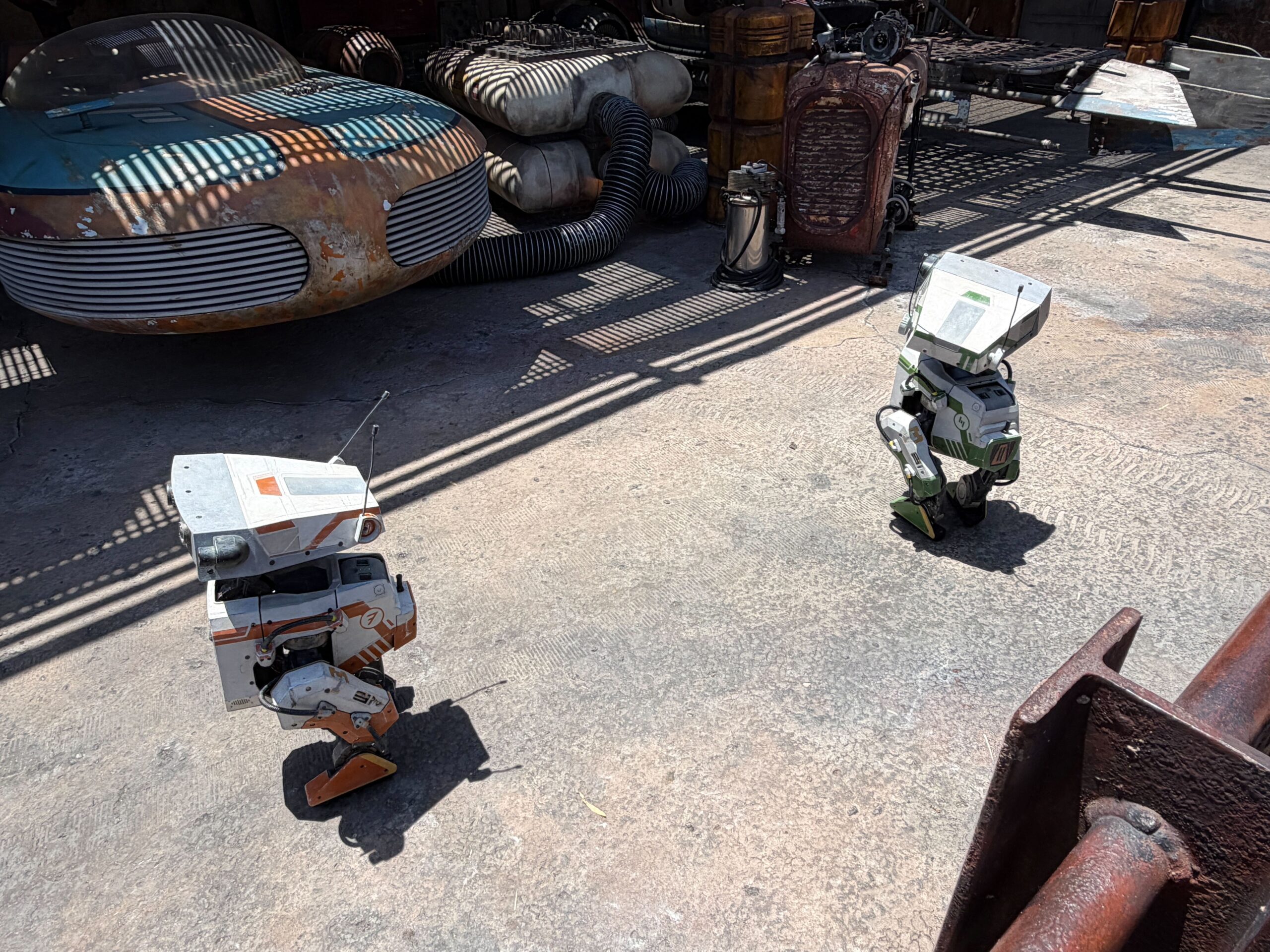 Oskar and Grek scanning the vehicles in the garage.