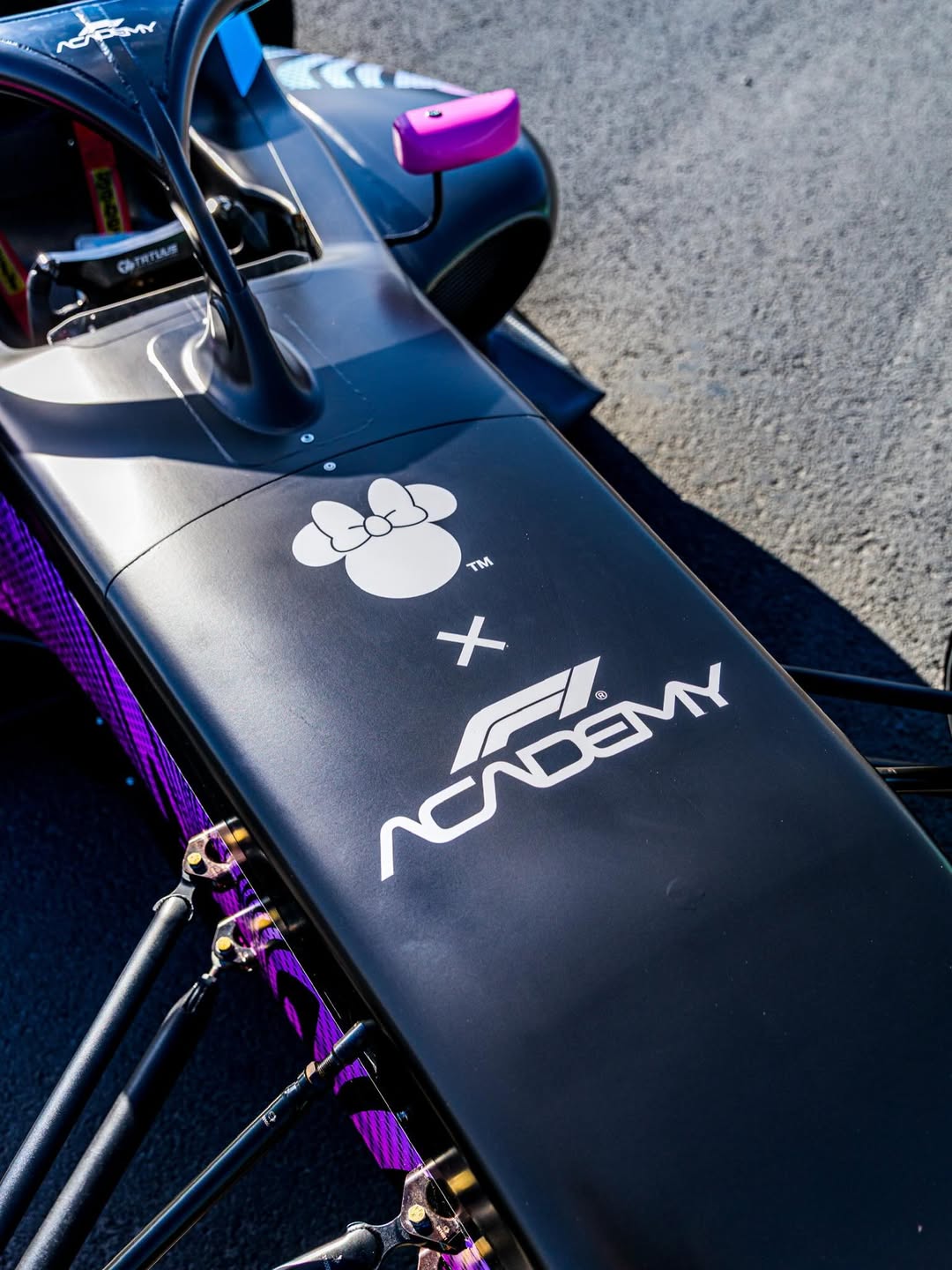 Minnie x F1 Academy collaboration logo.