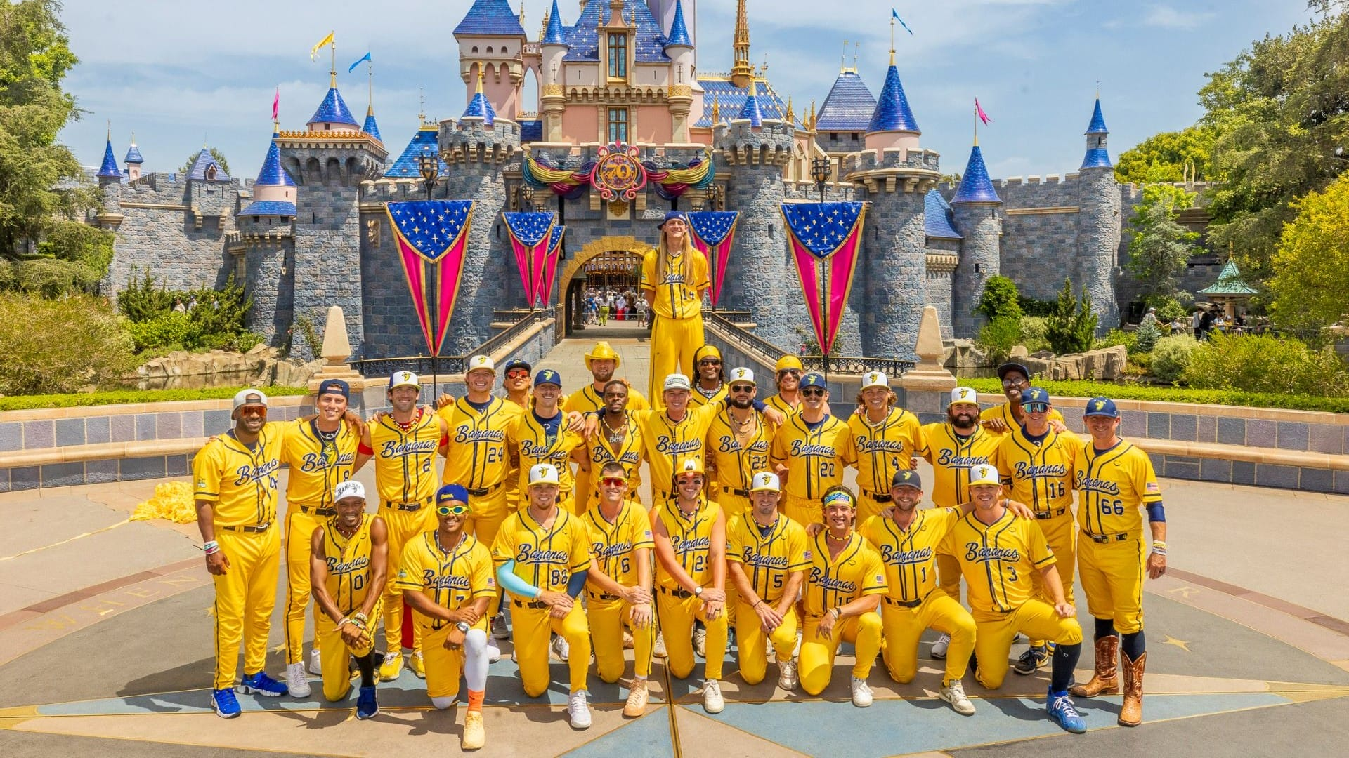 Banana Ball players in front of Sleeping Beauty Castle at Disneyland