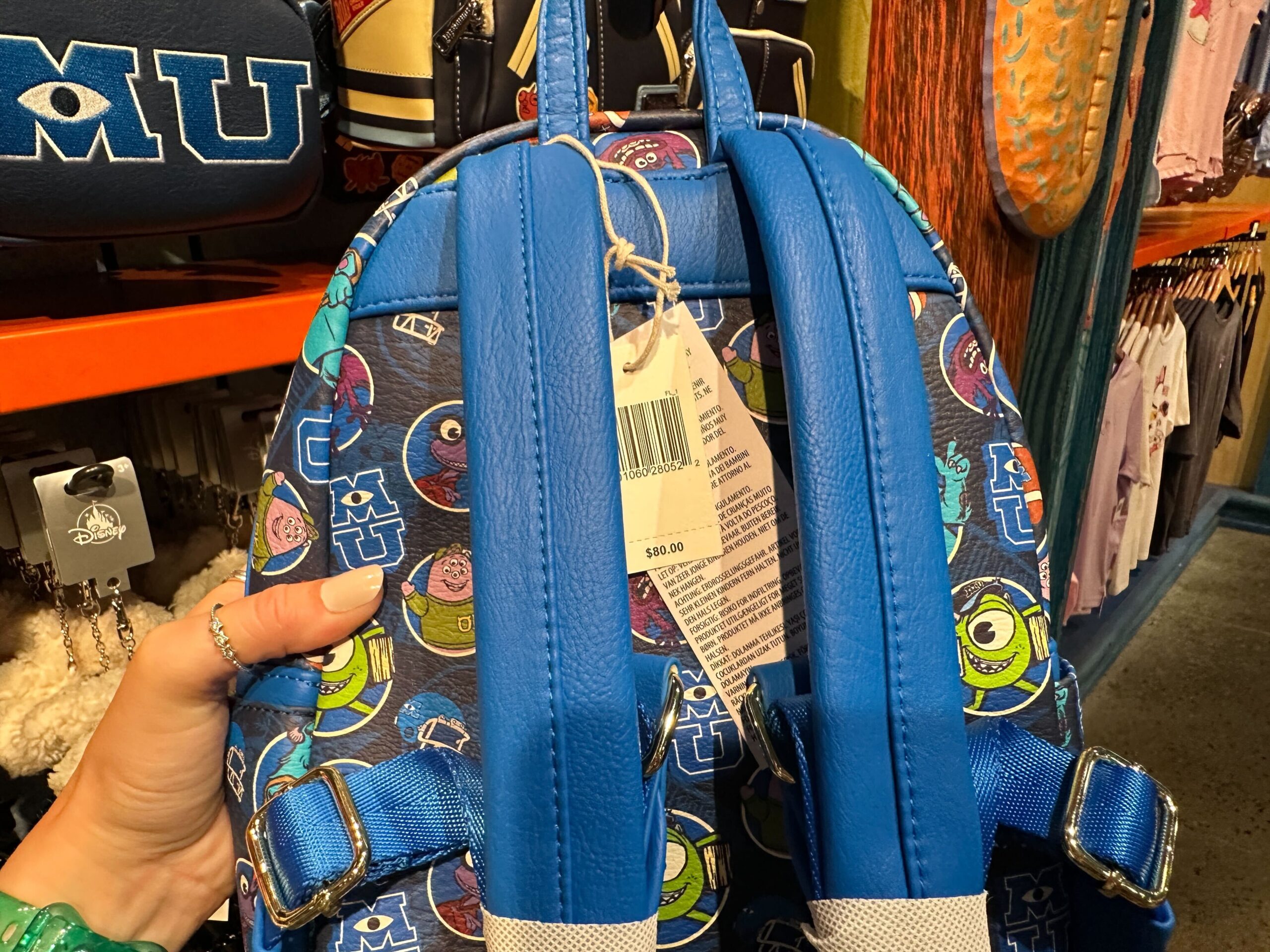 The same pattern on the front follows around to the back, as well as the inside of the bag. While the two backpack straps are plain blue.