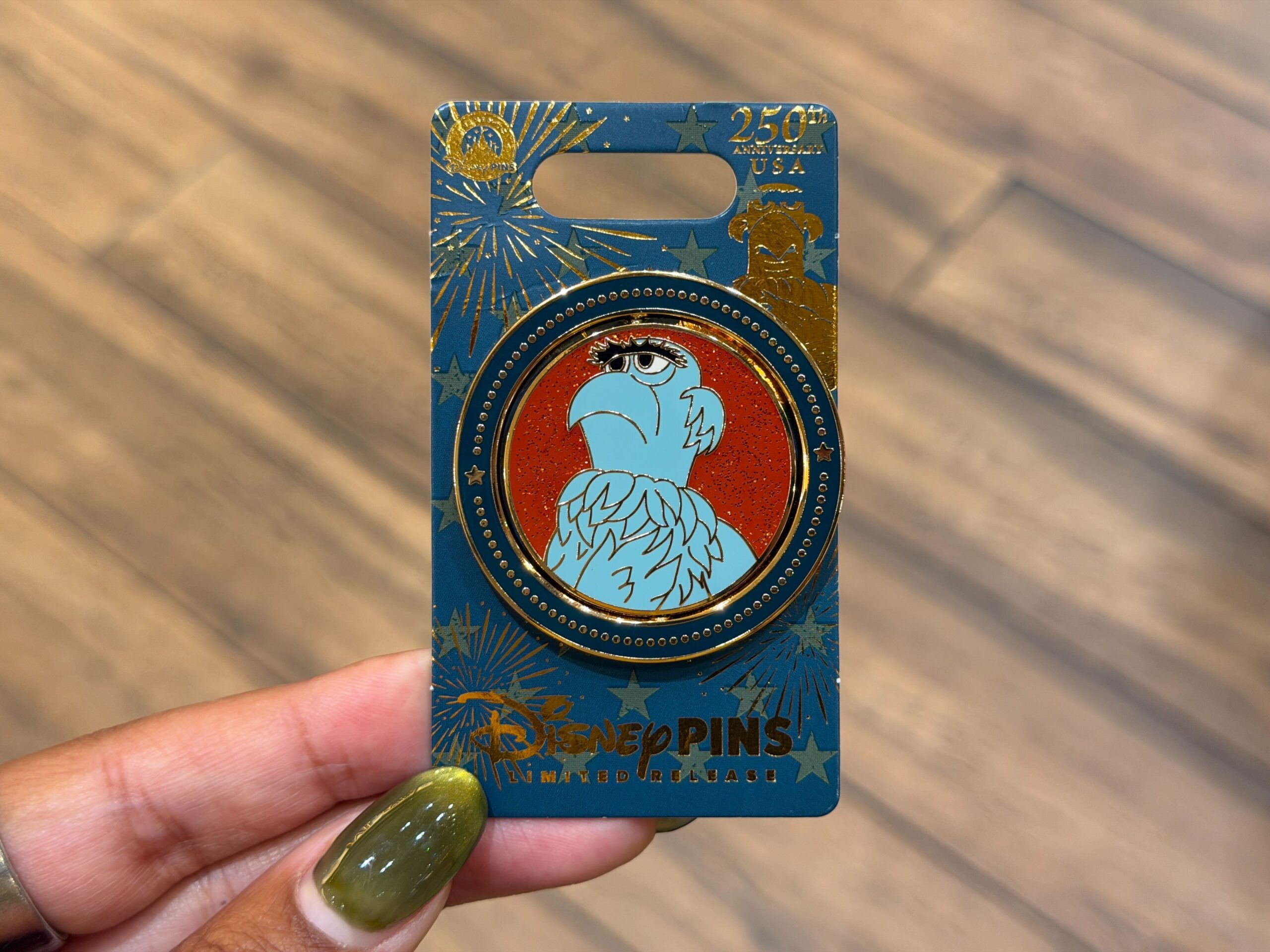 Sam Eagle is the star of this dual-sided pin. On the front is Sam against a bright red background with his wing over his chest as if about to recite the Pledge of Allegiance. On the back reads "Sam Eagle Distinctly Patriotic" and "Semiquincetennial United States of America."