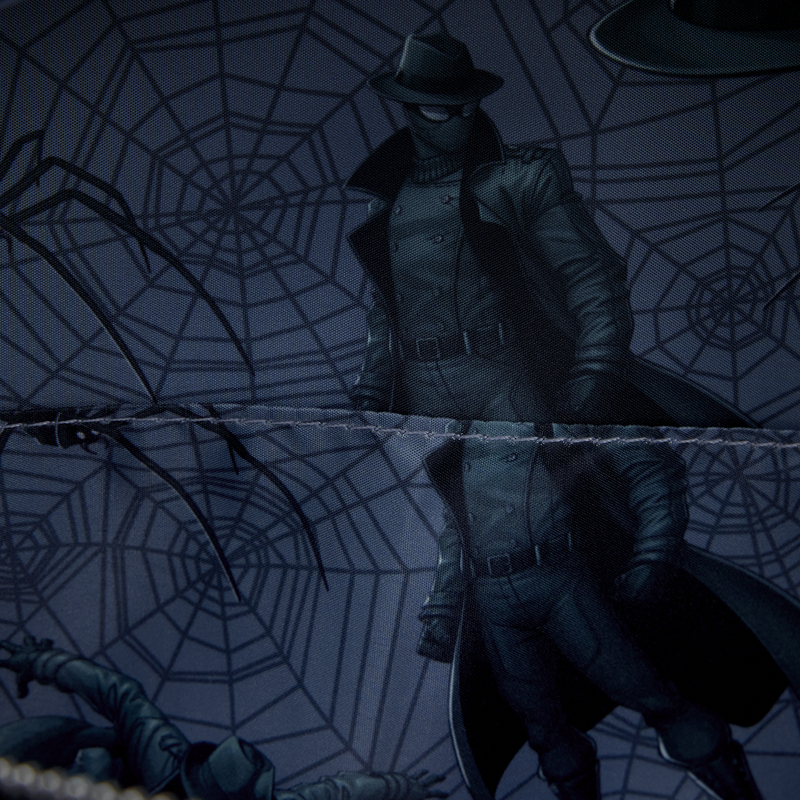 A patterned interior lining is seen on the inside of this bag. It shows a dark grey background with black spiderwebs throughout and Spider-Man Noir in various poses.