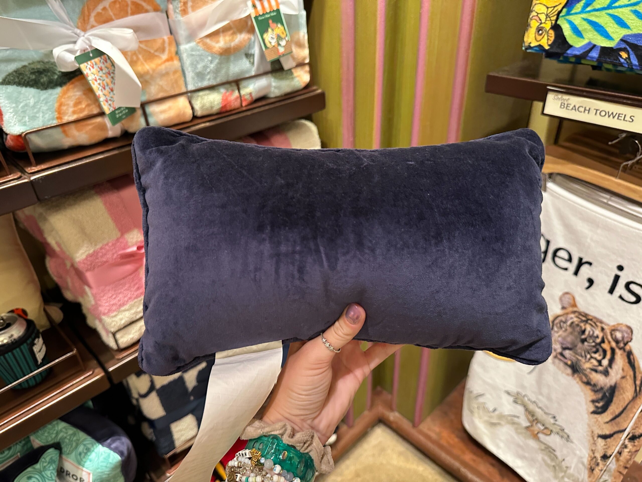 The back of the pillow is plain, covered in purple velvet material.