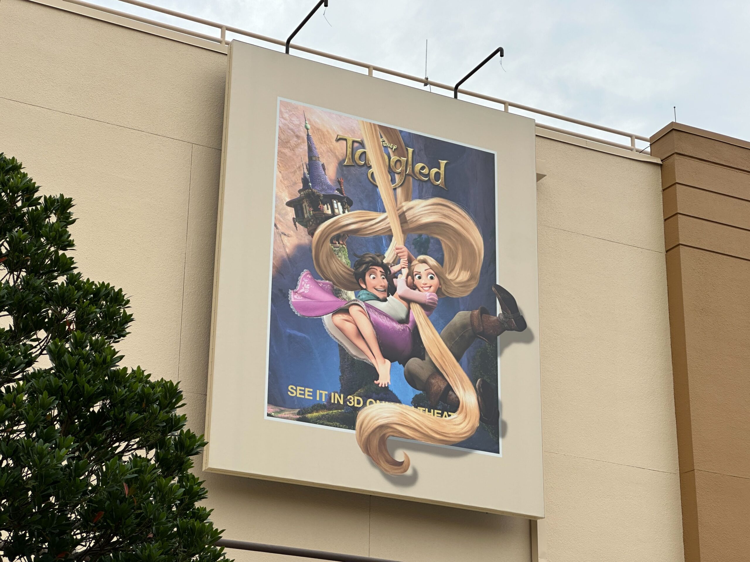 Another seemingly completed poster is from 2010's Tangled. It shows Flynn Rider holding Rapunzel as they swing from her hair. They, too, appear to be leaving the confines of the poster.