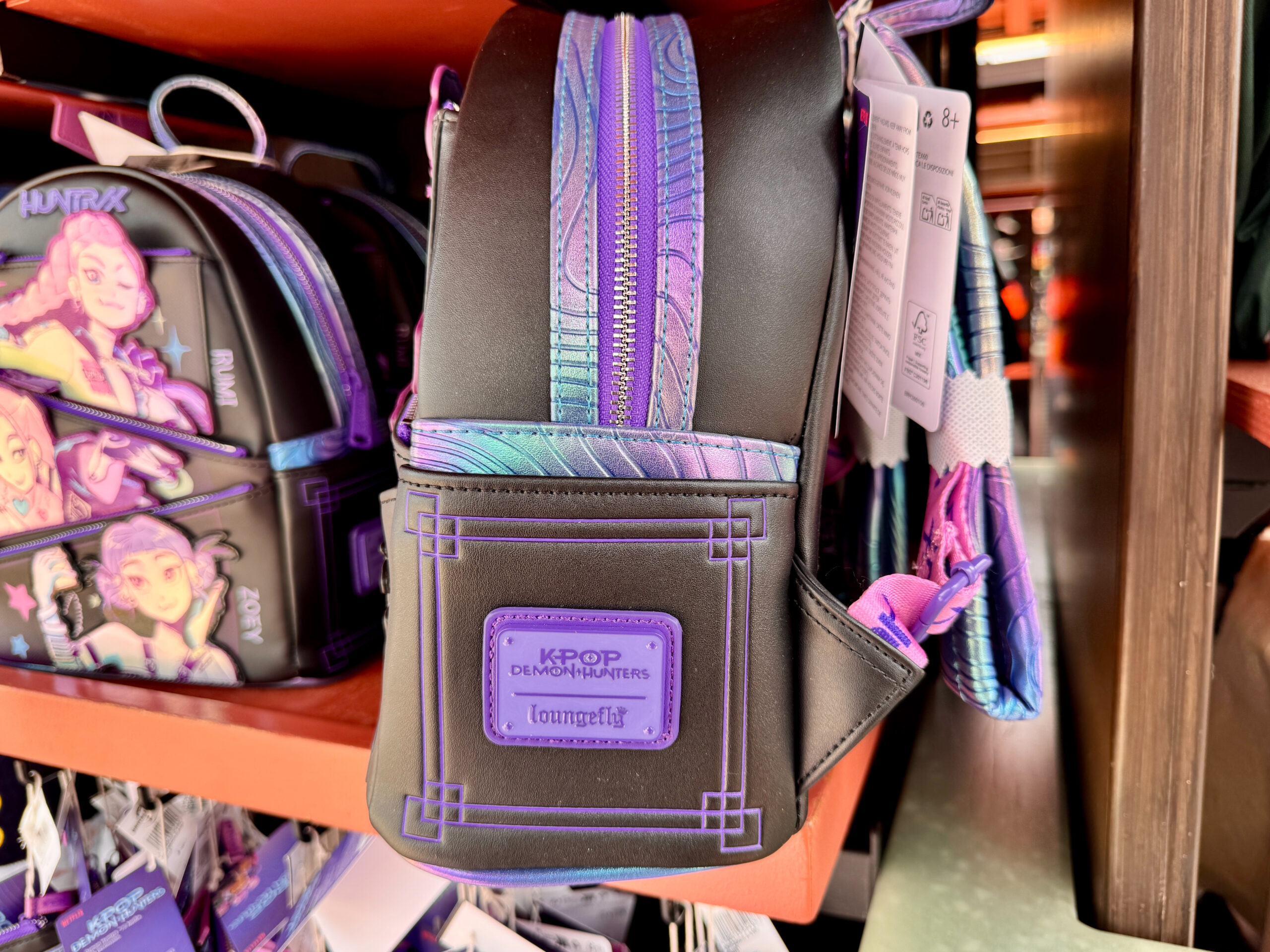 Side of Huntrix Loungefly Backpack.