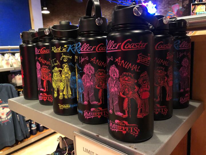 A black water bottle with Rock 'n' Roller Coaster starring the Muppets artwork and members of the Electric Mayhem band.