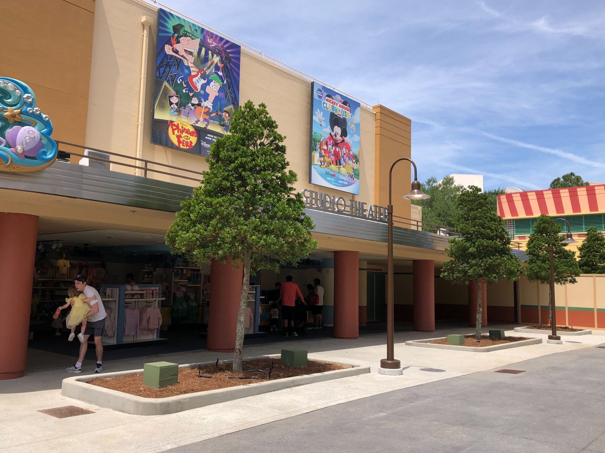 This space opened with the new planters and trees in late April. Brown lampposts have been installed where there were previously construction boxes.