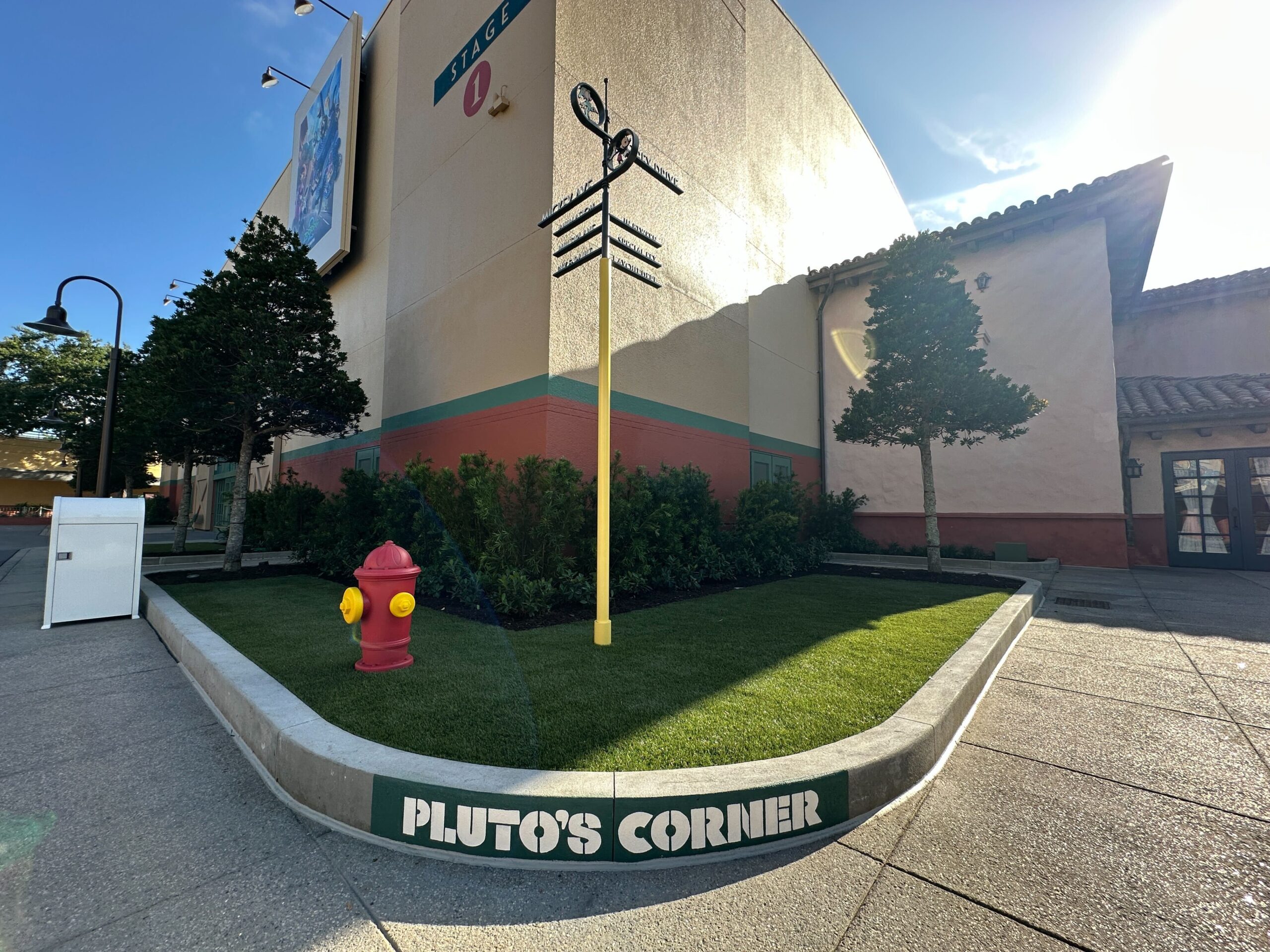 And underneath is a fun nod to Pluto with "Pluto's Corner" painted on the cement and a fire hydrant.