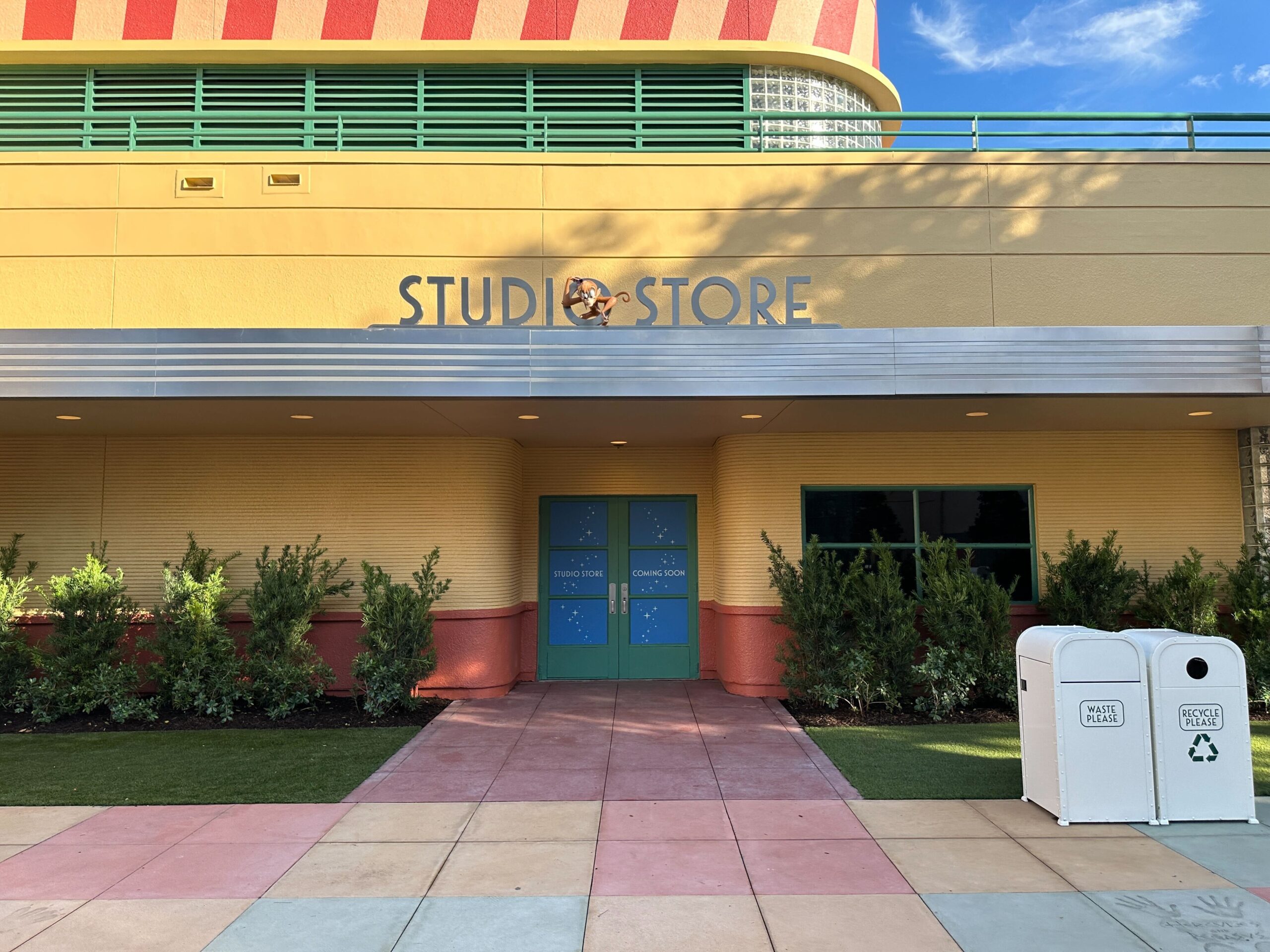 The Studios Store sign features Abu. There is the colored pavement but no signatures here.