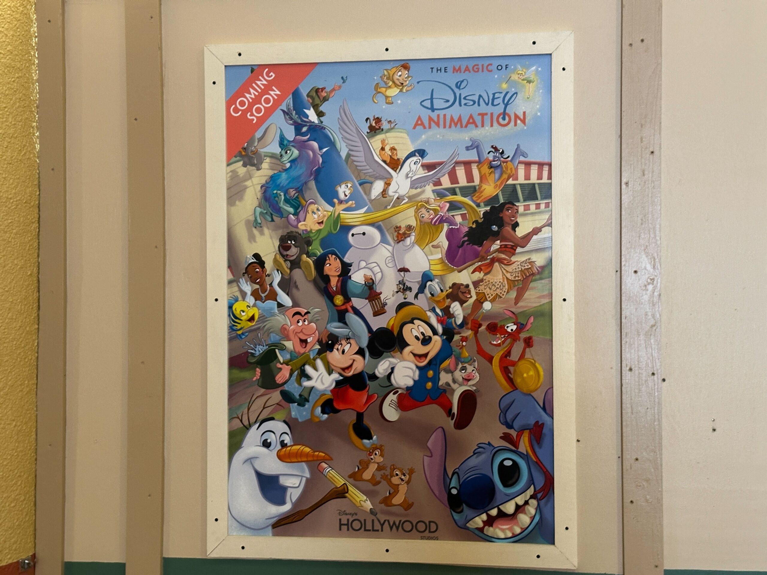 Another poster lets guests know that The Magic of Disney Animation is coming soon. The Magic of Disney Animation will open at a later date. Inside The Magic of Disney Animation, guests will meet characters, learn to draw with Olaf (instead of live artists), and play on an Alice in Wonderland playground.