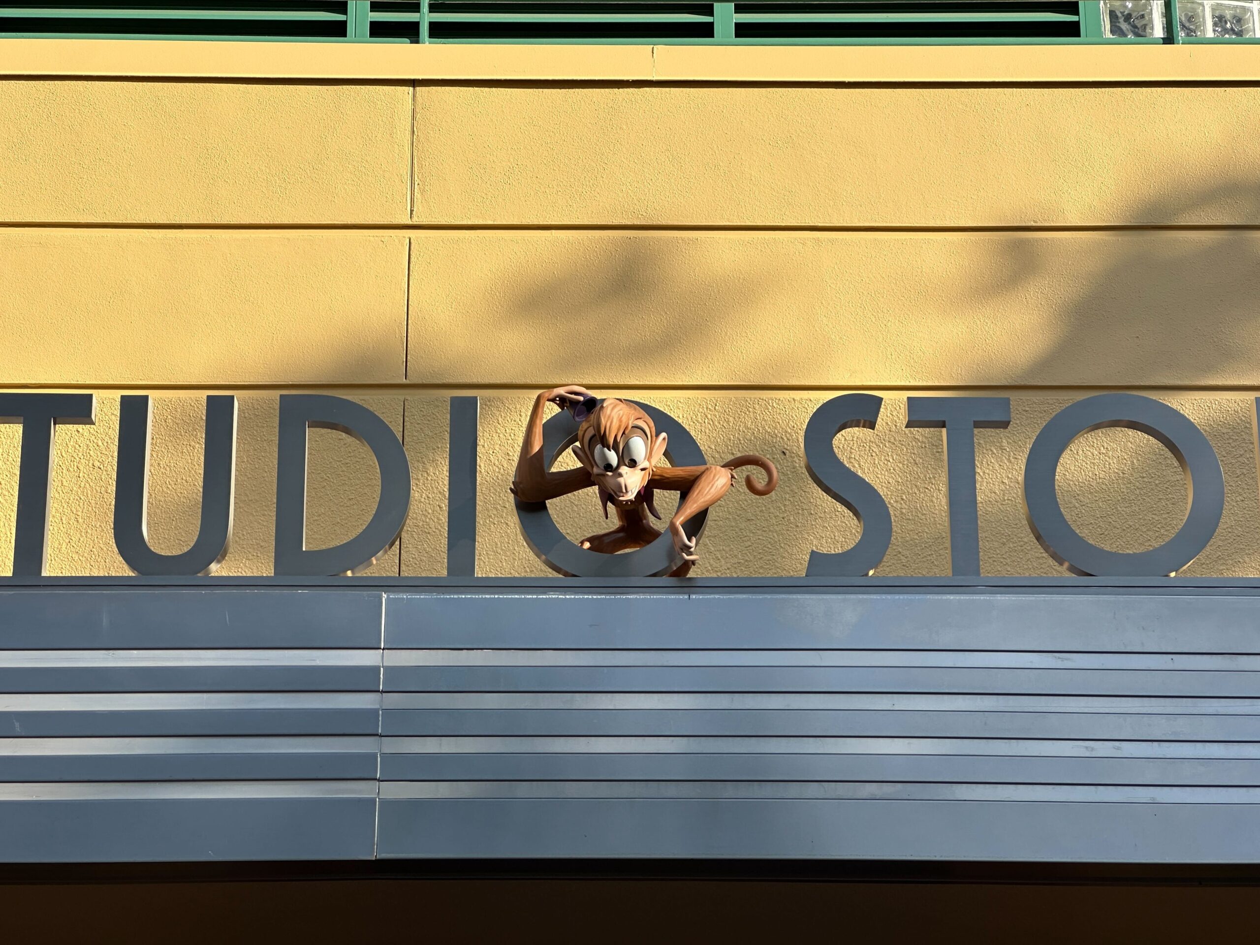 The Studios Store sign features Abu. There is the colored pavement but no signatures here.