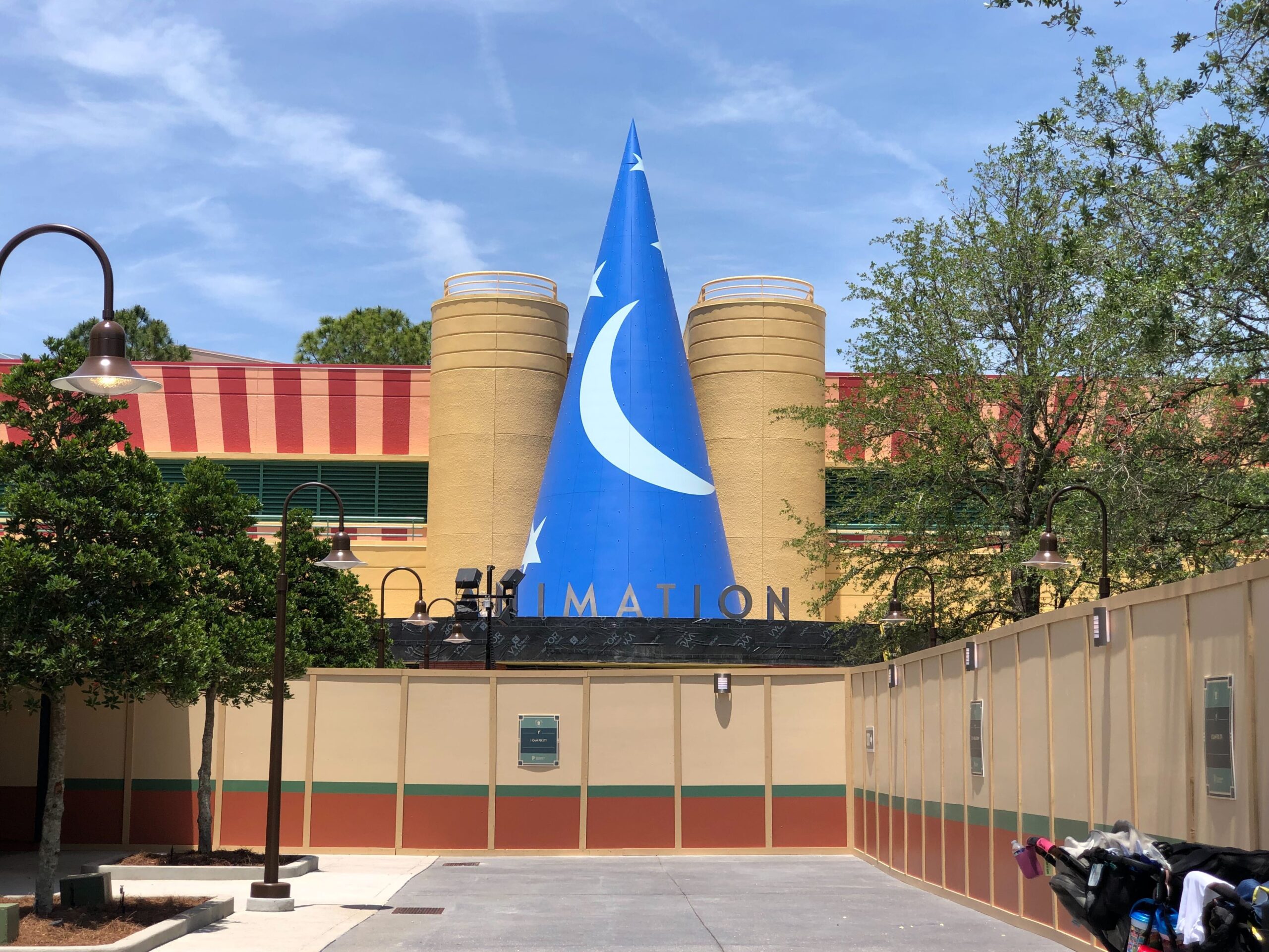 The big silver letters sit below the giant sorcerer hat on the front of the building. Guests will enter The Magic of Disney Animation under the letters.