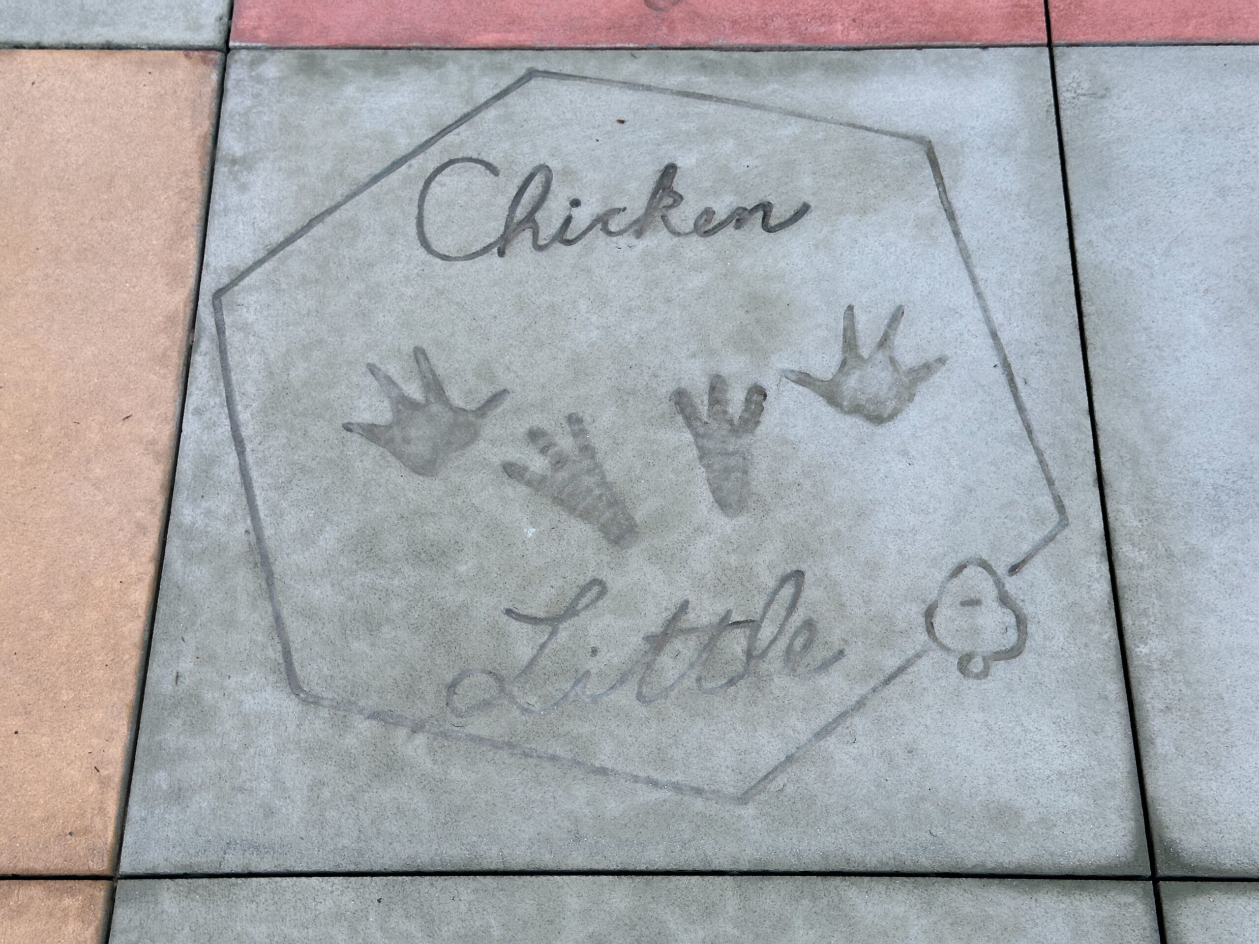 Pavement near The Magic of Disney Animation features character autographs and handprints. Again, many characters across several of Disney's most beloved films are represented here.
