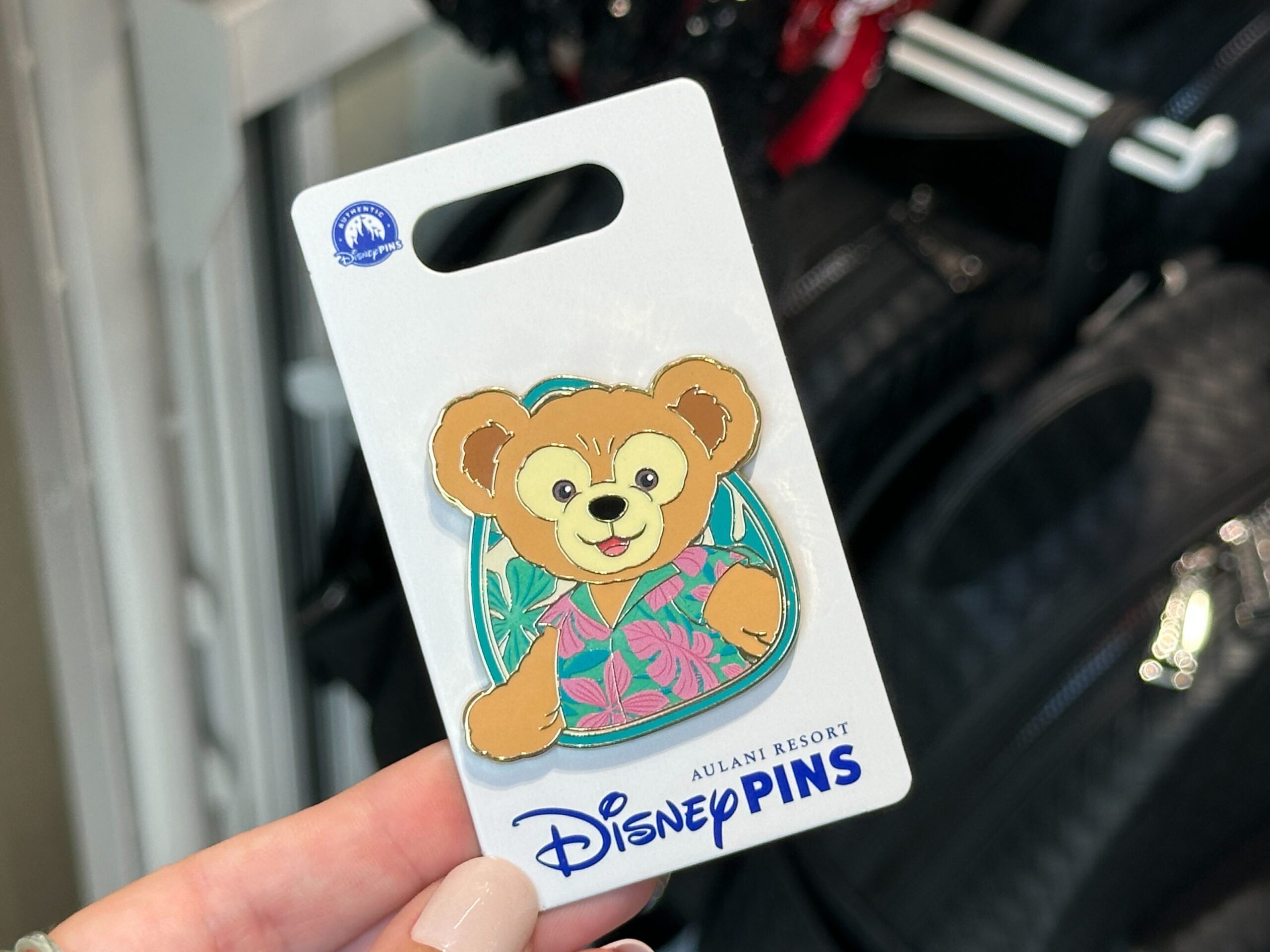 Each pin depicts a character straight out of the sweatshirt artwork. Duffy wears his Hawaiian shirt in front of a leafy background.