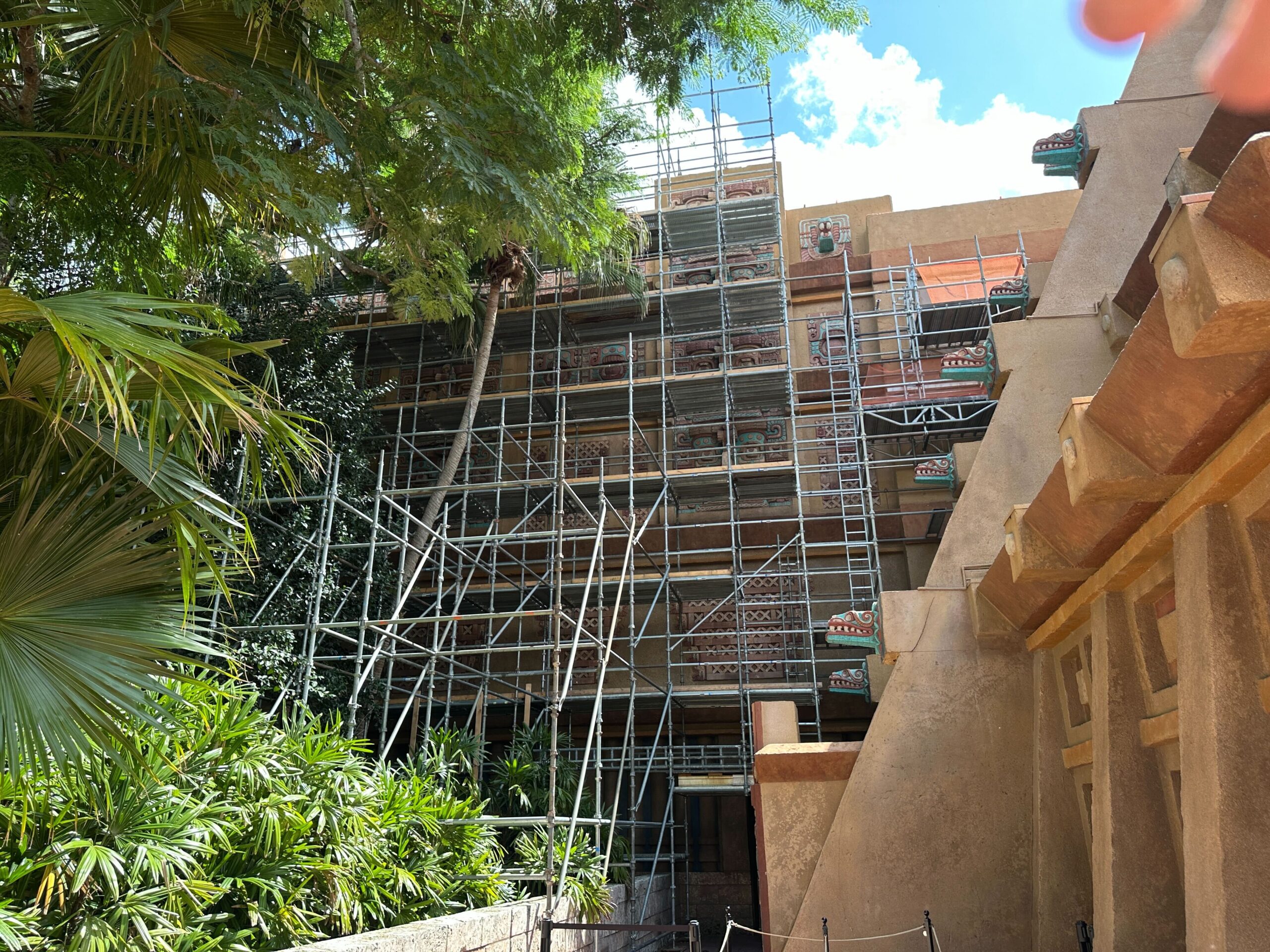 Ropes and stanchions still block the far left entrance, where the scaffolding is located. Crews appear to be working on the pyramid's themed details.