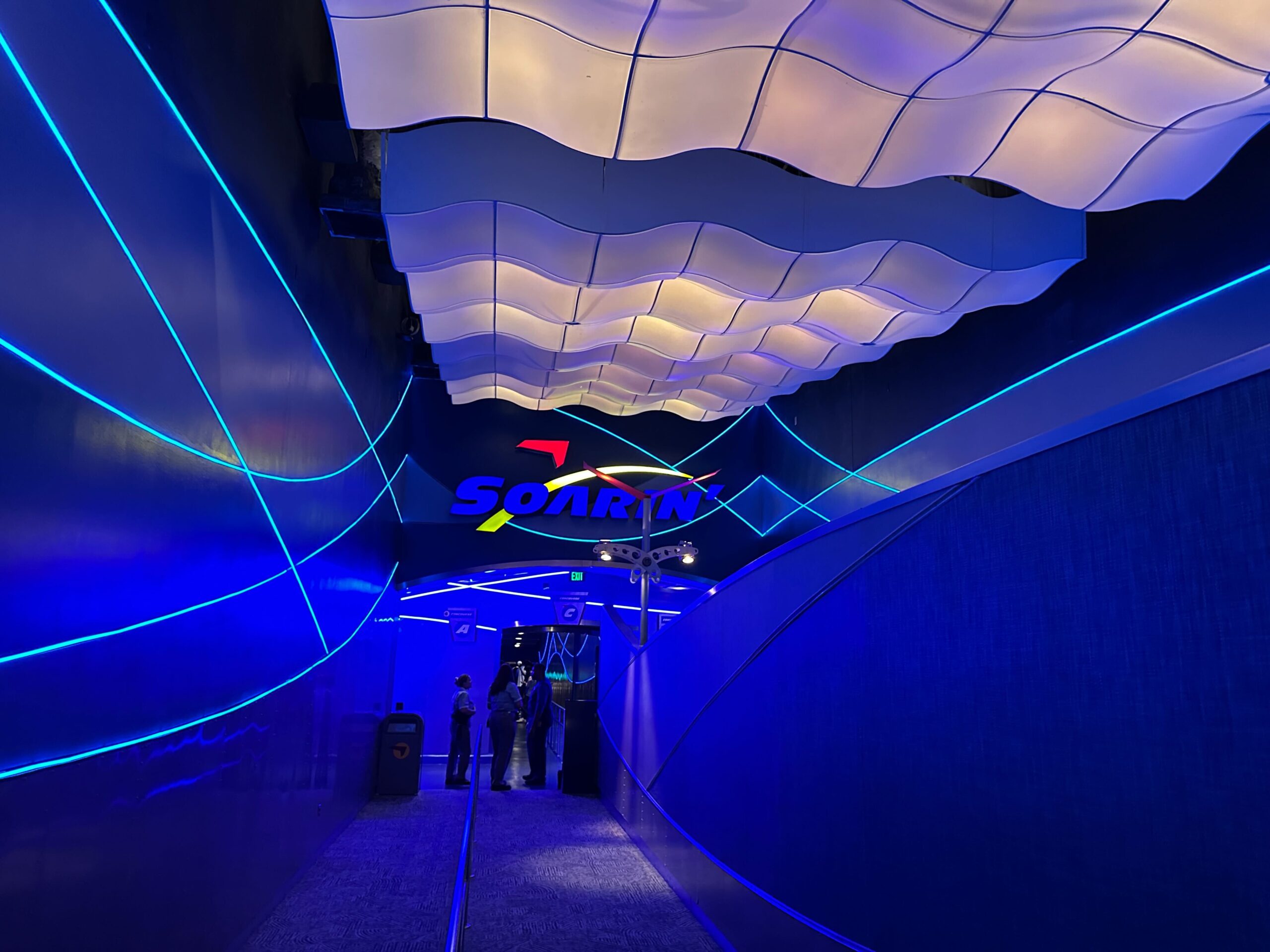 Crews continue to replace the carpeting throughout the Soarin' queue in EPCOT with a brand-new design. They have also started to refurbish the blue lighting in the second half of the queue.