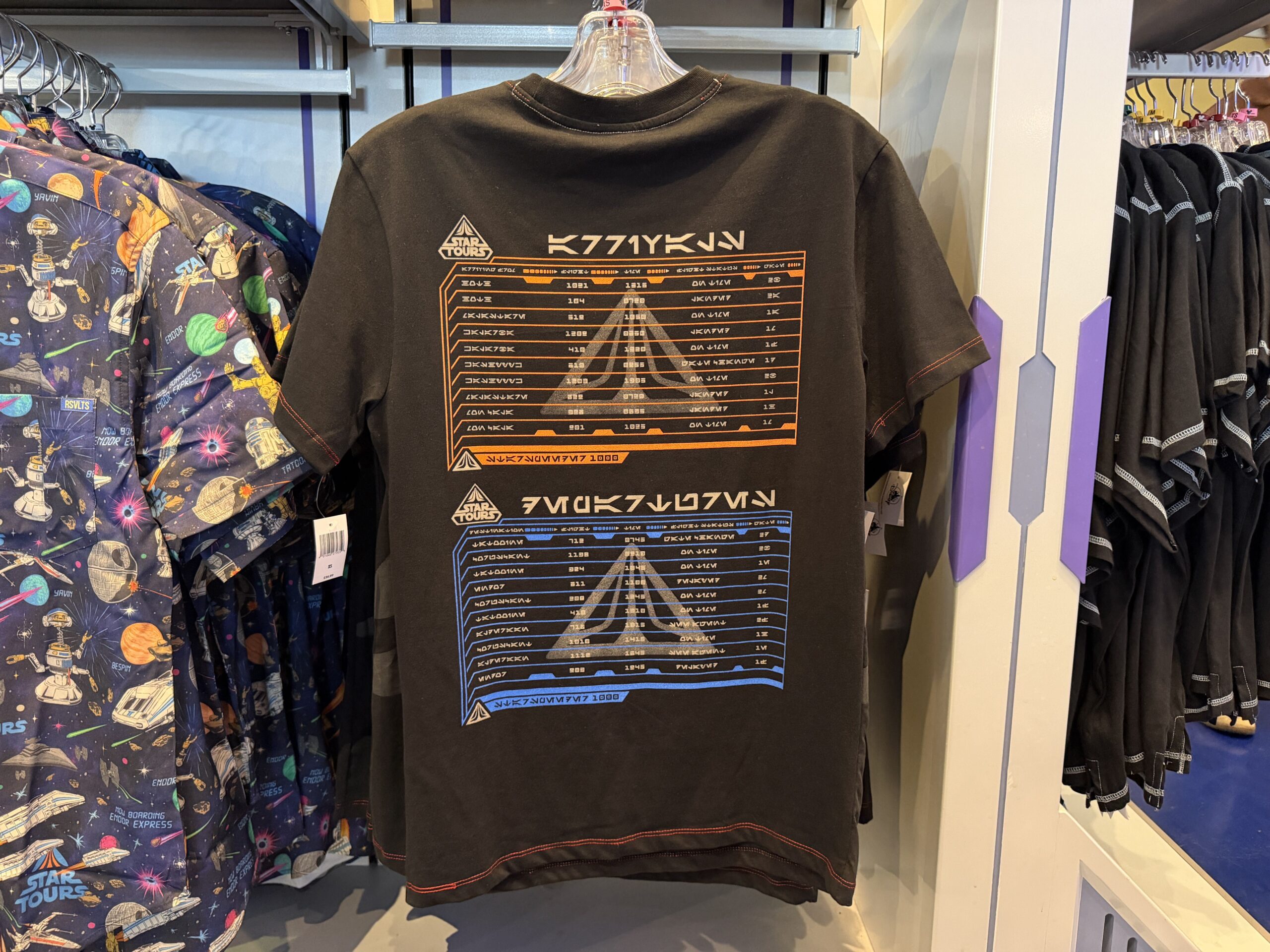 A new wave of Star Wars merchandise has arrived at Disneyland, including several graphic T-shirts, a keychain, and multiple Hasbro Black Series figures inspired by Star Wars: Attack of the Clones, The Mandalorian & Grogu, Star Tours, and more.