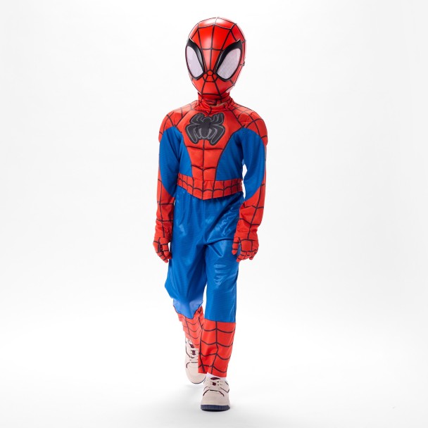 The top features faux muscle padding across the chest, shoulders, and stomach, with Spidey’s black spider emblem on the front. The red-and-blue design includes webbing throughout the arms and upper body, plus red webbed panels on the lower legs.