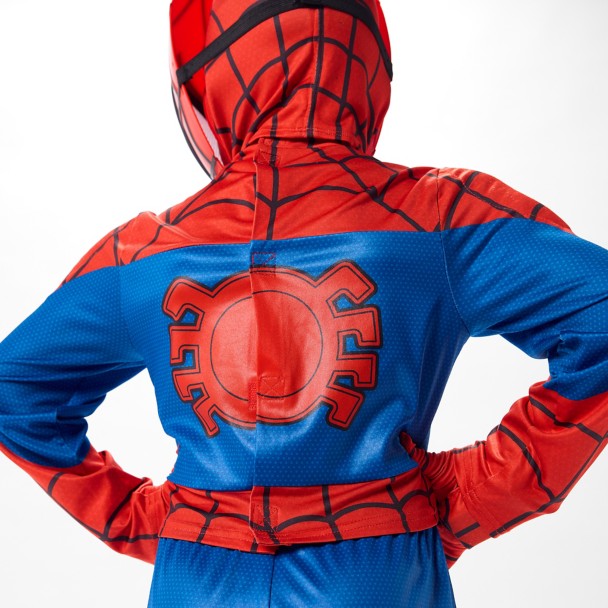 The top features faux muscle padding across the chest, shoulders, and stomach, with Spidey’s black spider emblem on the front. The red-and-blue design includes webbing throughout the arms and upper body, plus red webbed panels on the lower legs.