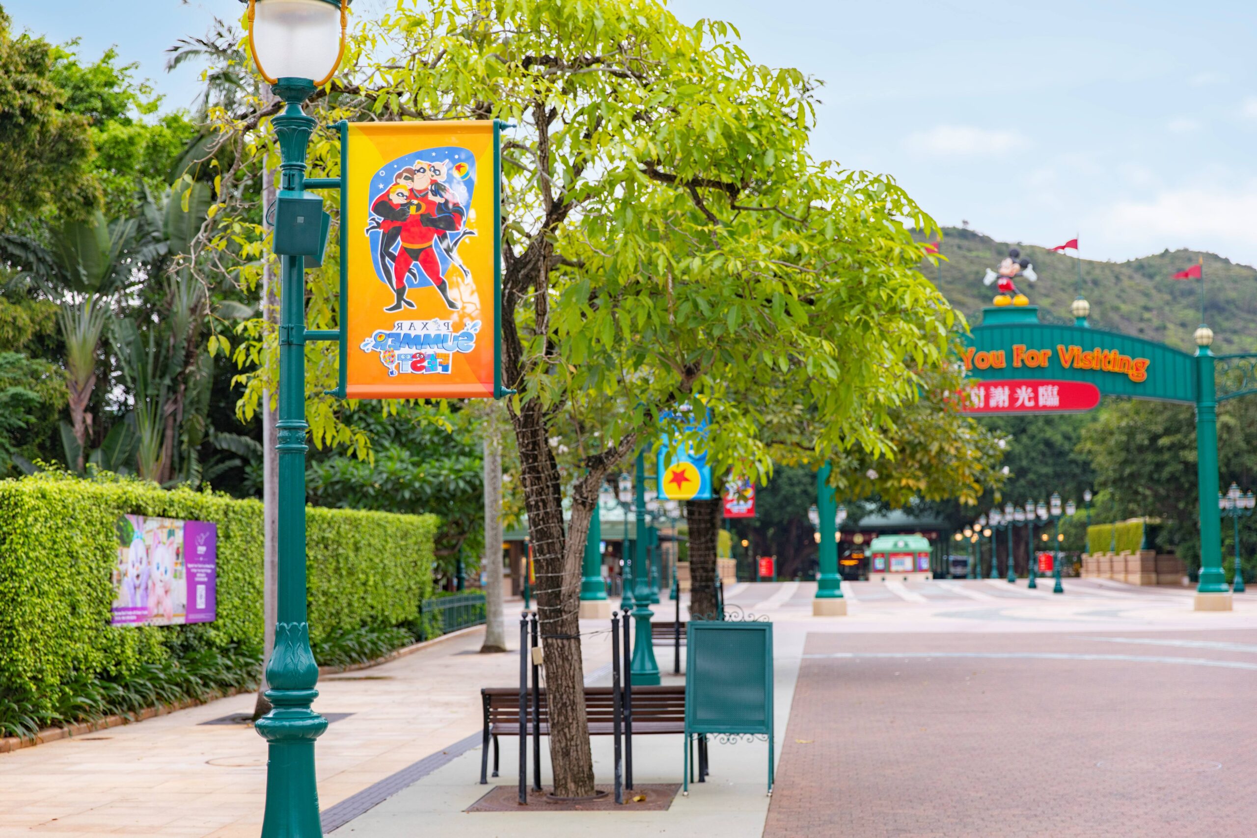 Hong Kong Disneyland is decorated with banners, a giant Luxo Jr. lamp, and a light-up Pixar ball for their first-ever Pixar Summer Fest. The celebration runs from June 12 to August 31, 2026.