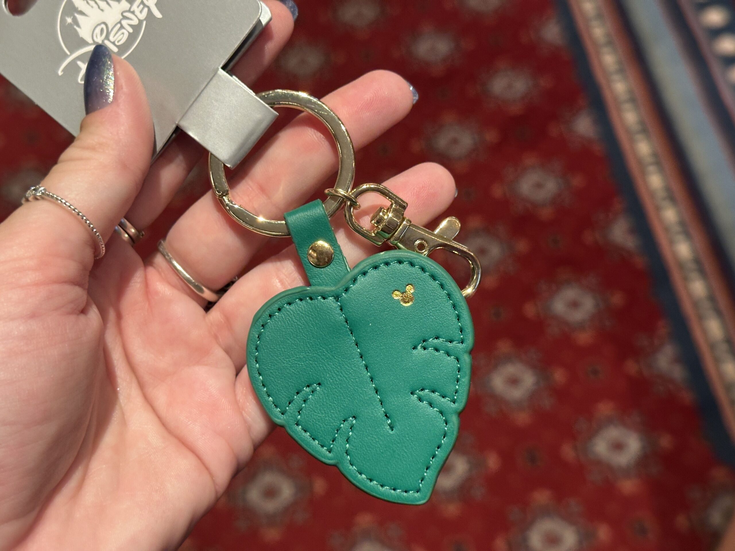 Logo Mania keychains have arrived at Walt Disney World, including a tropical leaf design