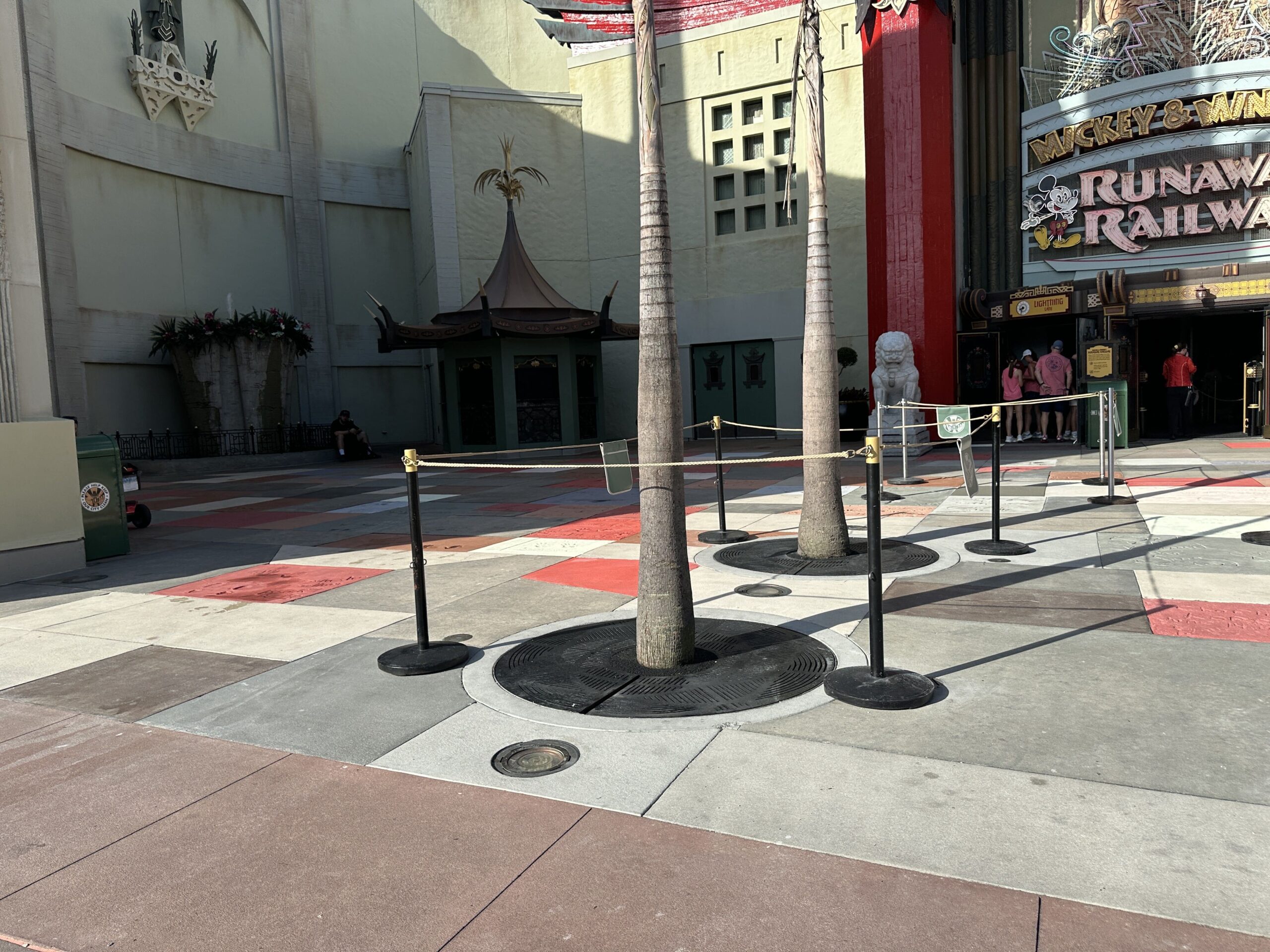 Construction crews are replacing sections of themed pavement and Walk of Fame-style concrete slabs outside the Chinese Theatre at Disney's Hollywood Studios.