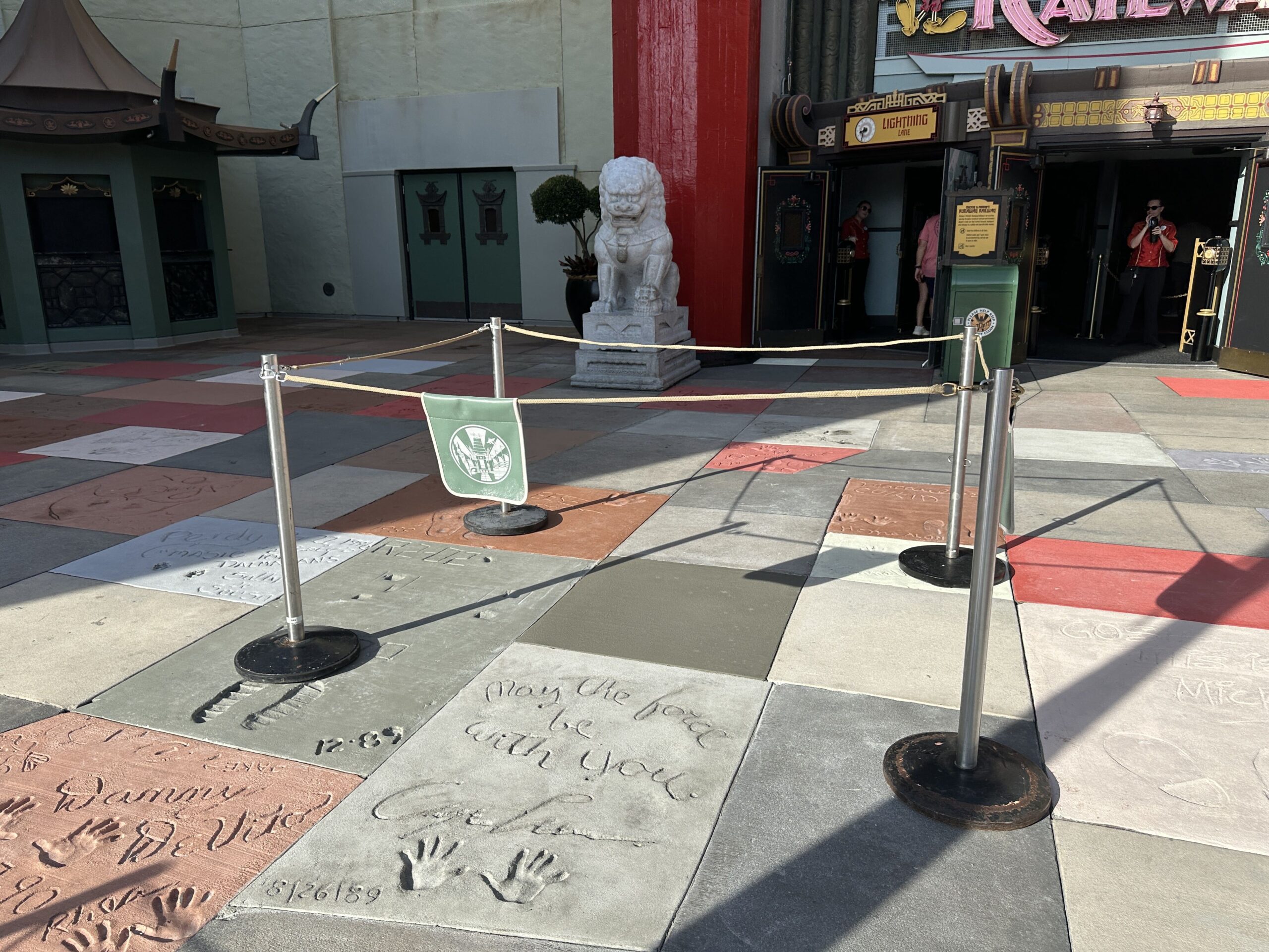 Construction crews are replacing sections of themed pavement and Walk of Fame-style concrete slabs outside the Chinese Theatre at Disney's Hollywood Studios.