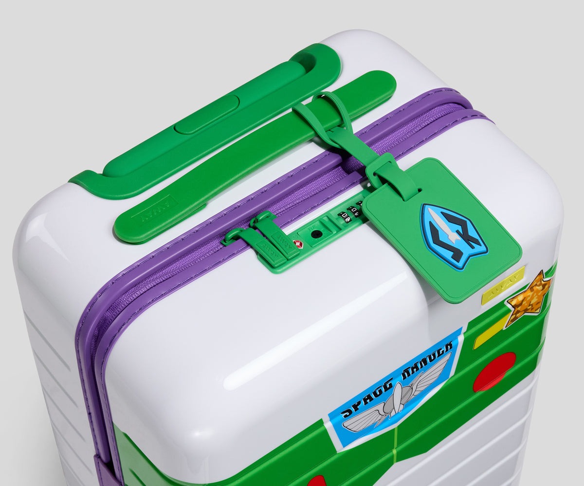 Buzz Lightyear fans can get this Kids Carry-On inspired by his spacesuit. It's mostly white with green wheels and a green handle, and printed buttons across the front. There's also a sparkly star sticker — a reference to Toy Story 5.