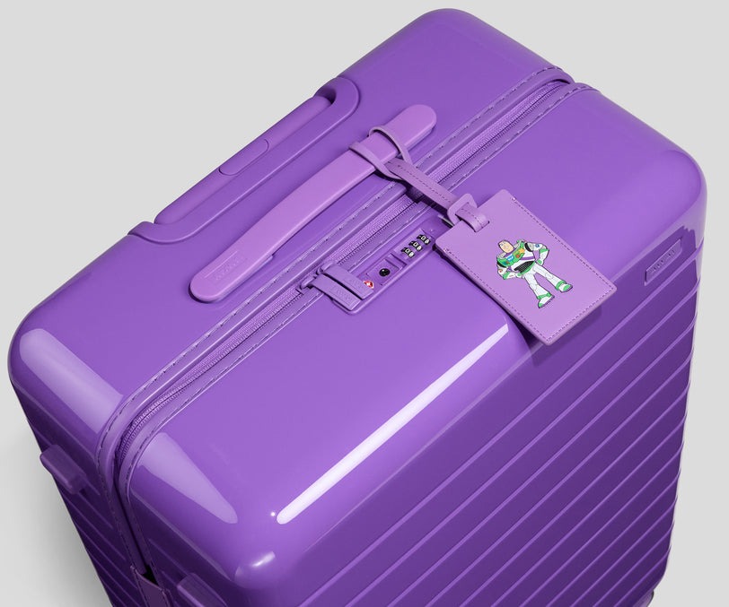 The Buzz Lightyear-inspired Medium bag has a high-gloss finish. It's solid purple.