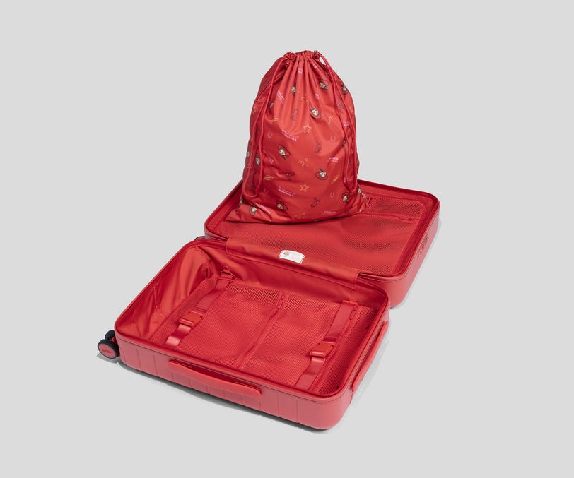 Inspired by the new sheriff in town, this red bag has a matte finish. These slightly smaller suitcases are 22.7" x 15.4" x 9.6". Capacity is 49 L.