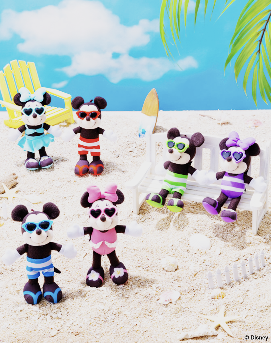 The plush charms, previewed by Tokyo Disney Resort on Instagram, show Minnie and Mickey in three different swimsuits hanging out on the beach.