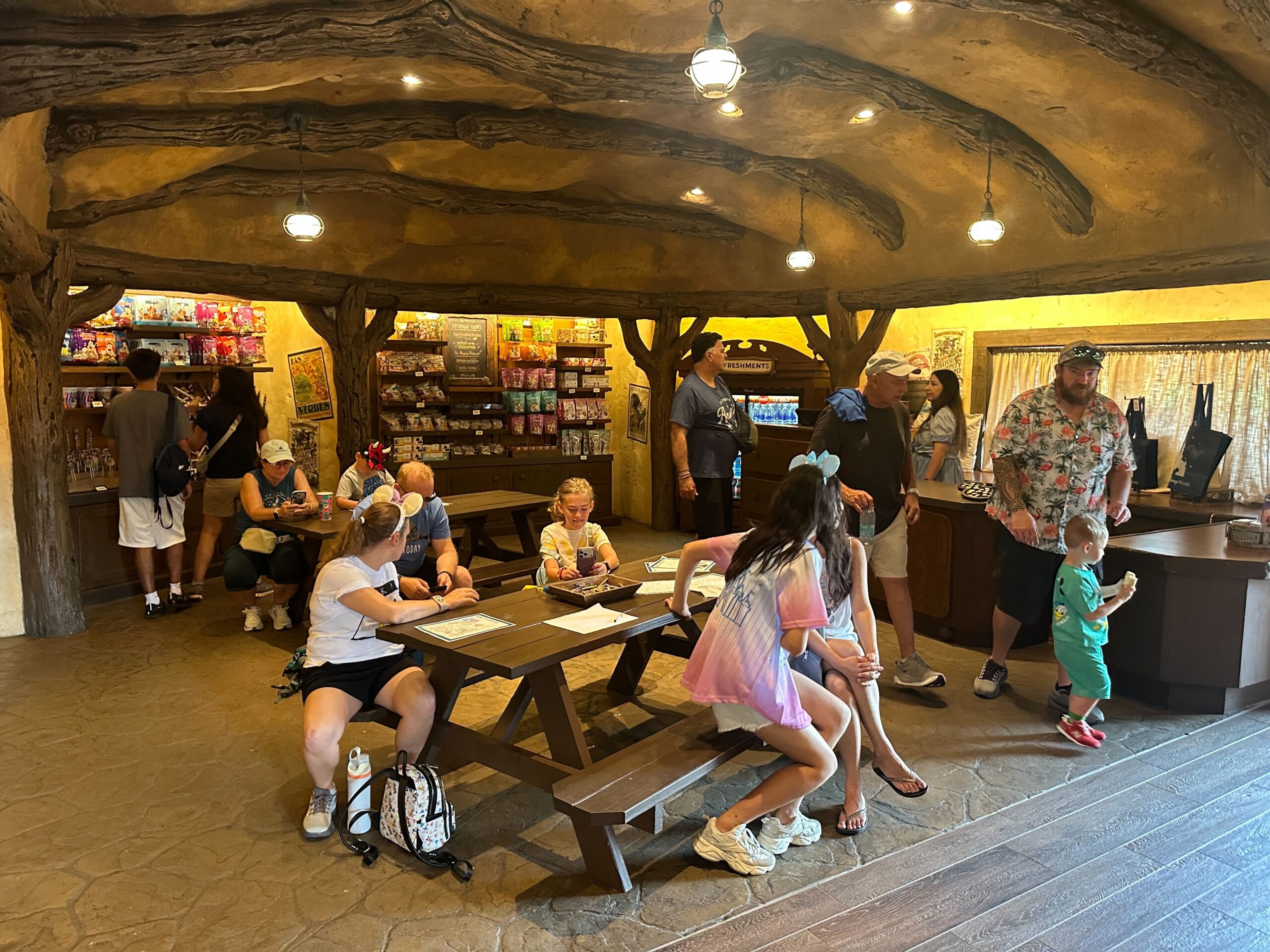 There is a coloring station positioned near the pin trading board at Critter Co-Op near Tiana's Bayou Adventure. Kids (or kids at heart) can take a break and do some coloring to get out of the heat or the rain (or both.)