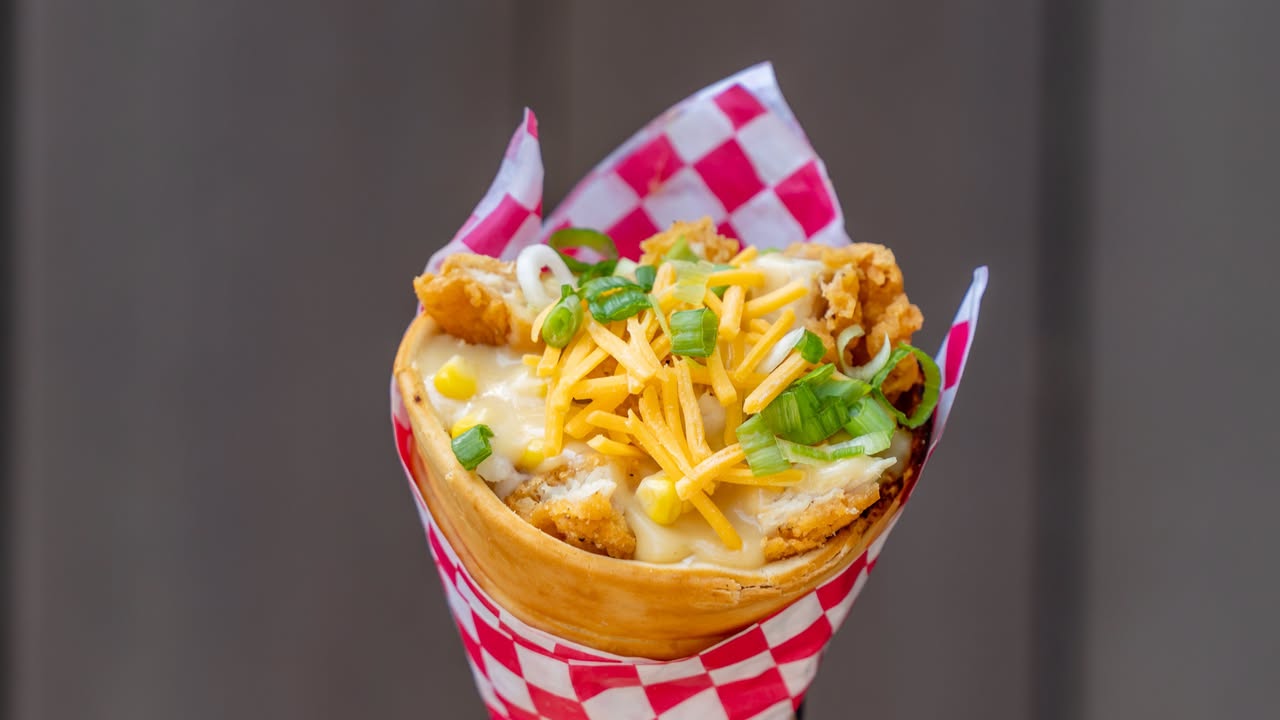 Fried Chicken Cone (at Cozy Cone Motel: Chili Cone Queso): Chopped fried chicken, garlic mashed potatoes, chicken gravy, and cheese topped with green onions
