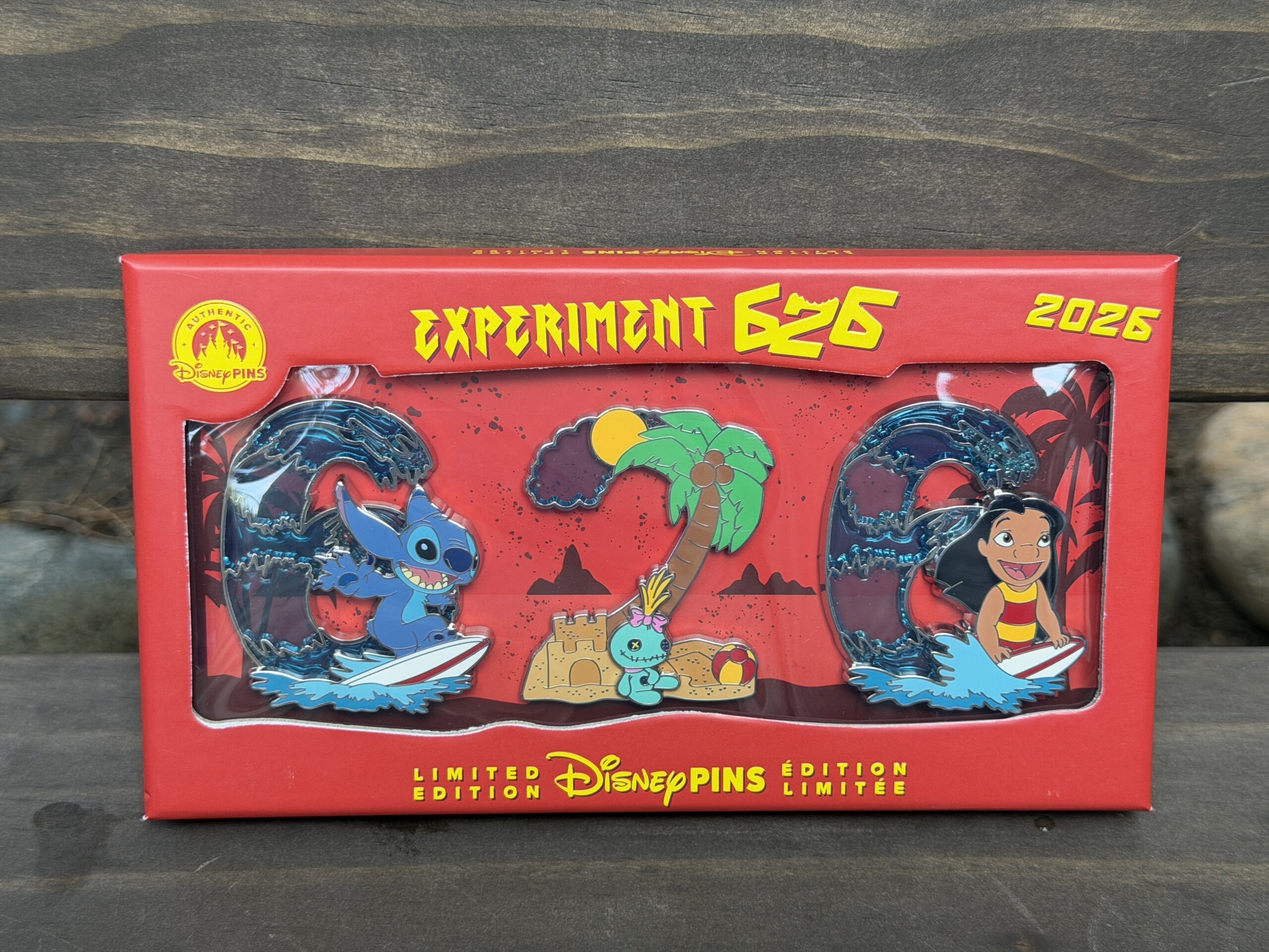 Limited edition of 3,000, this box set includes three pins shaped like the letters of "626." They create an oceanic scene, with the "6" pins depicting Stitch and Lilo surfing the waves. The "2" pin has Scrump sitting next to a sandcastle below a palm tree.