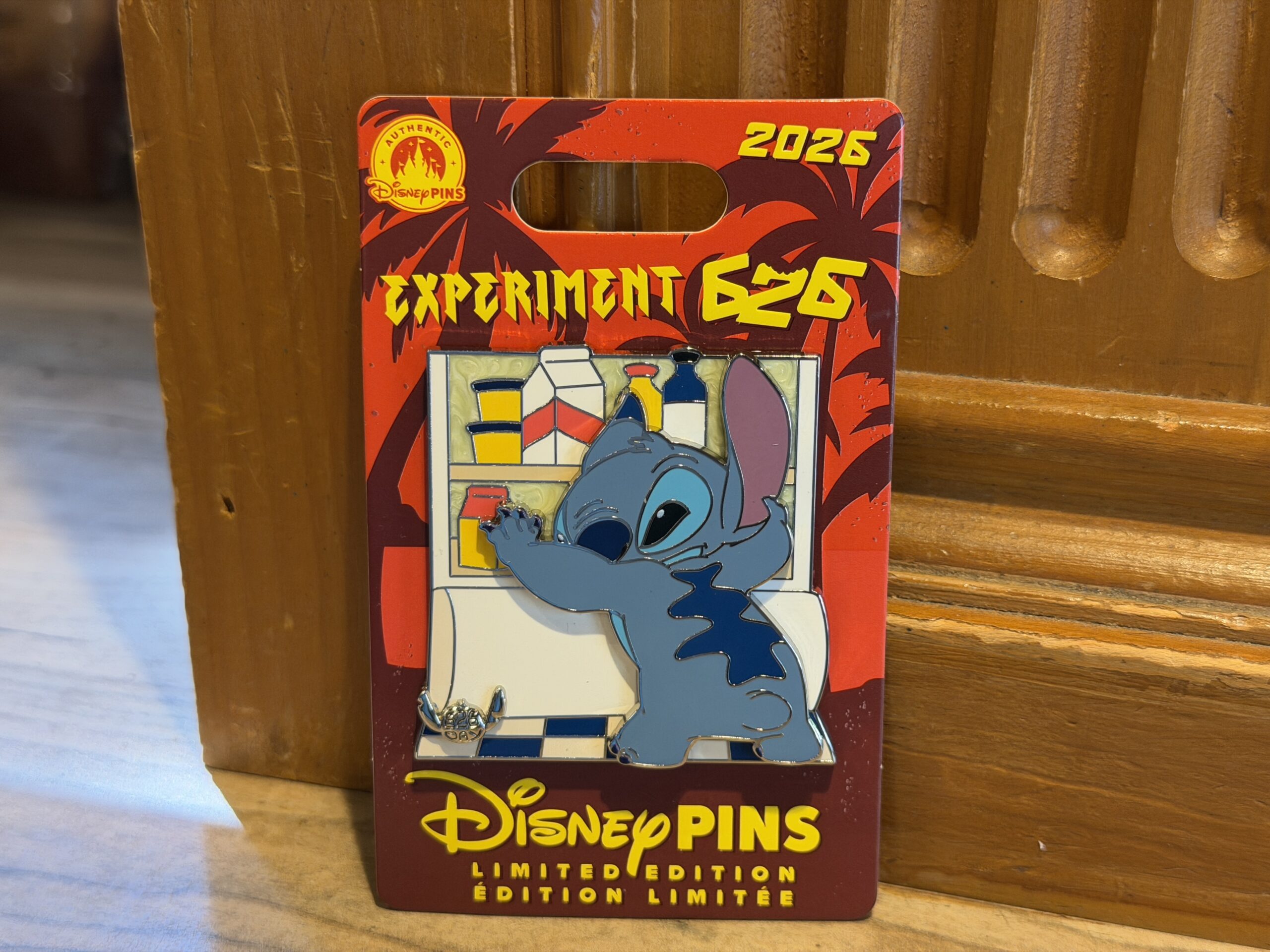 Stitch is pictured raiding the fridge on this pin. It also has a silver 626 Day element in the corner.