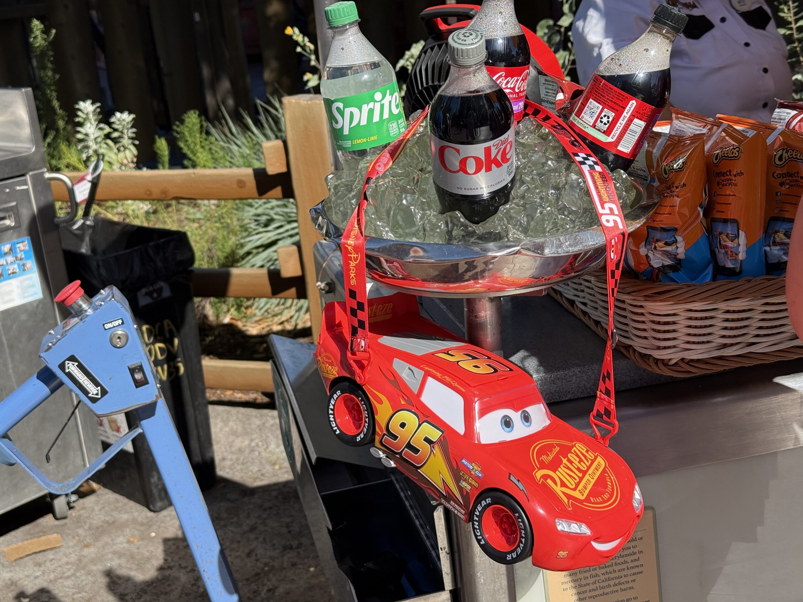 To celebrate the 20th anniversary of Pixar's Cars, a new Lightning McQueen popcorn bucket has been released. The bucket is available at multiple dining locations in Disney California Adventure.
