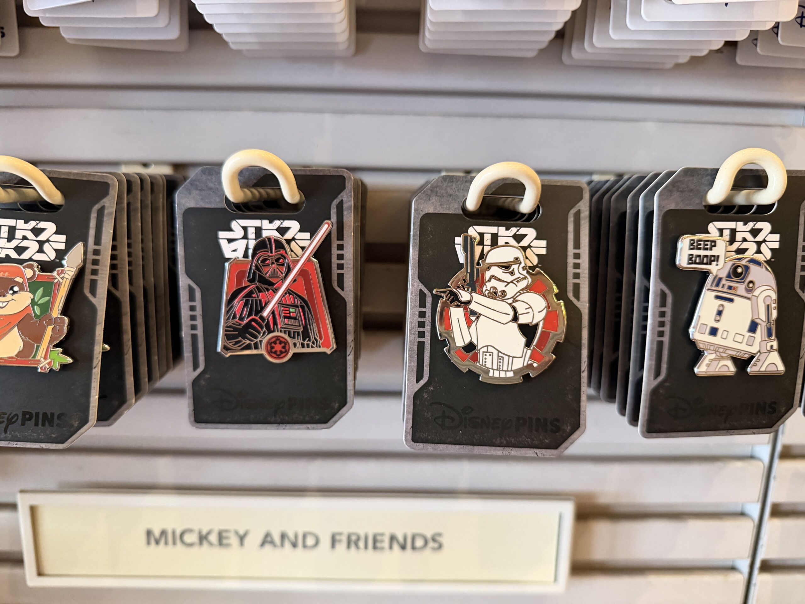 Star Wars pins received new card backings.