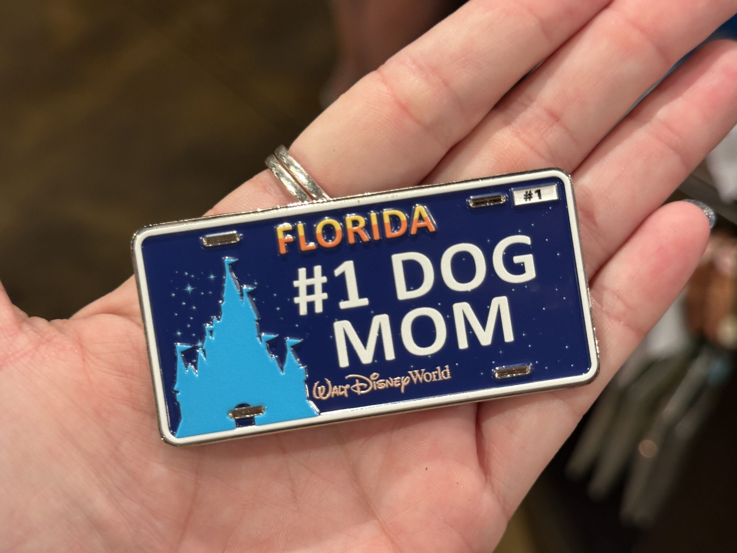 This license plate magnet is the same as the one above, except it says "#1 Dog Mom."