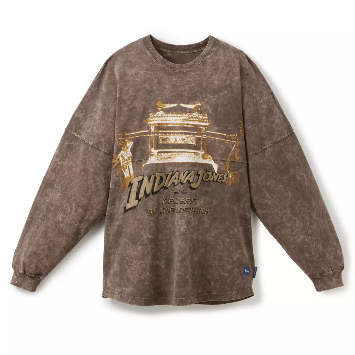 In a weathered brown fabric material, almost resembling leather, this Spirit Jersey highlights Raiders of the Lost Ark. On the front, we see the film title and logo just below the coveted Ark of the Covenant.