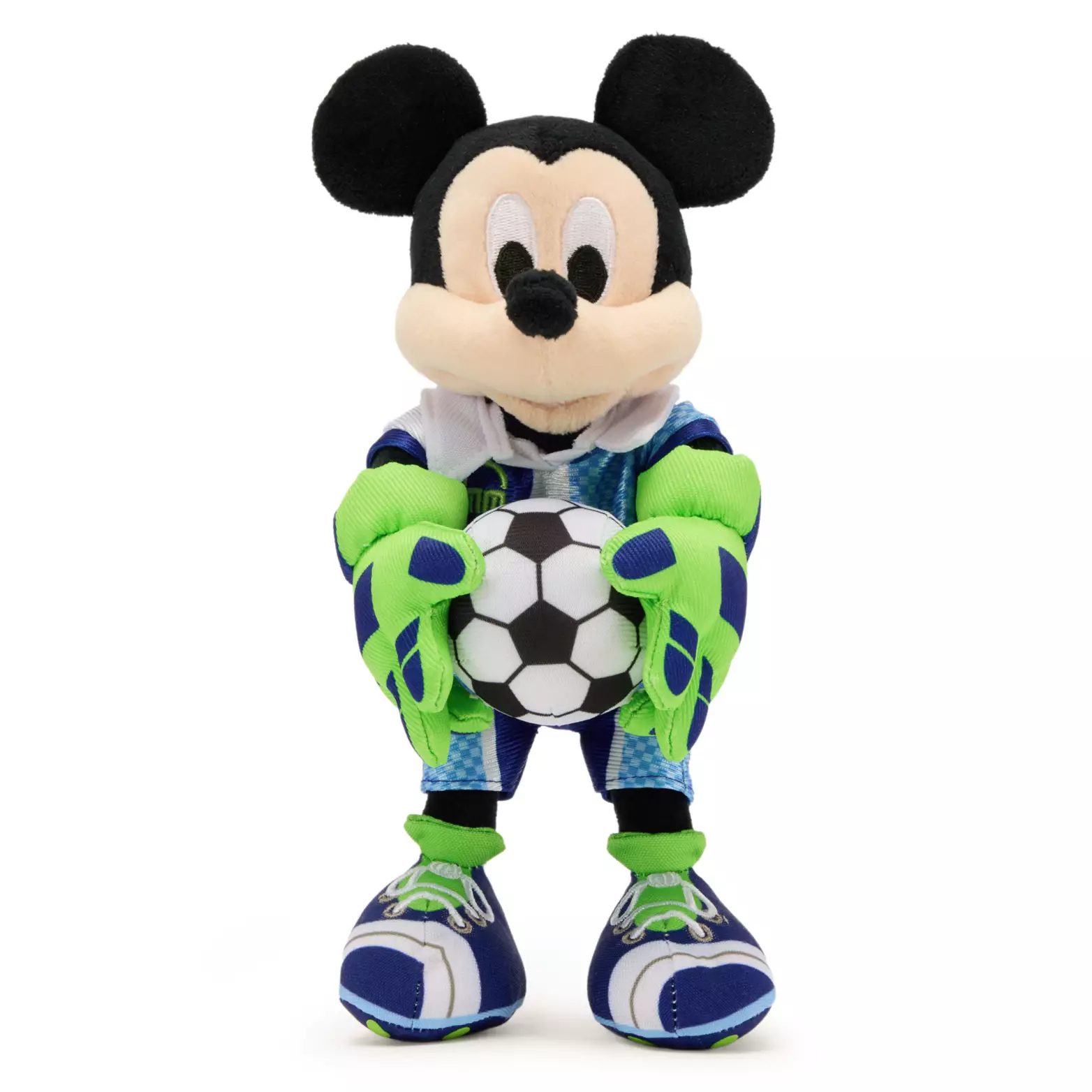 Mickey has traded his usual white gloves for green and blue goalie gloves with this new plush. He's wearing a blue soccer ensemble and matching cleats. He is holding a soccer ball between the oversized goalie gloves.