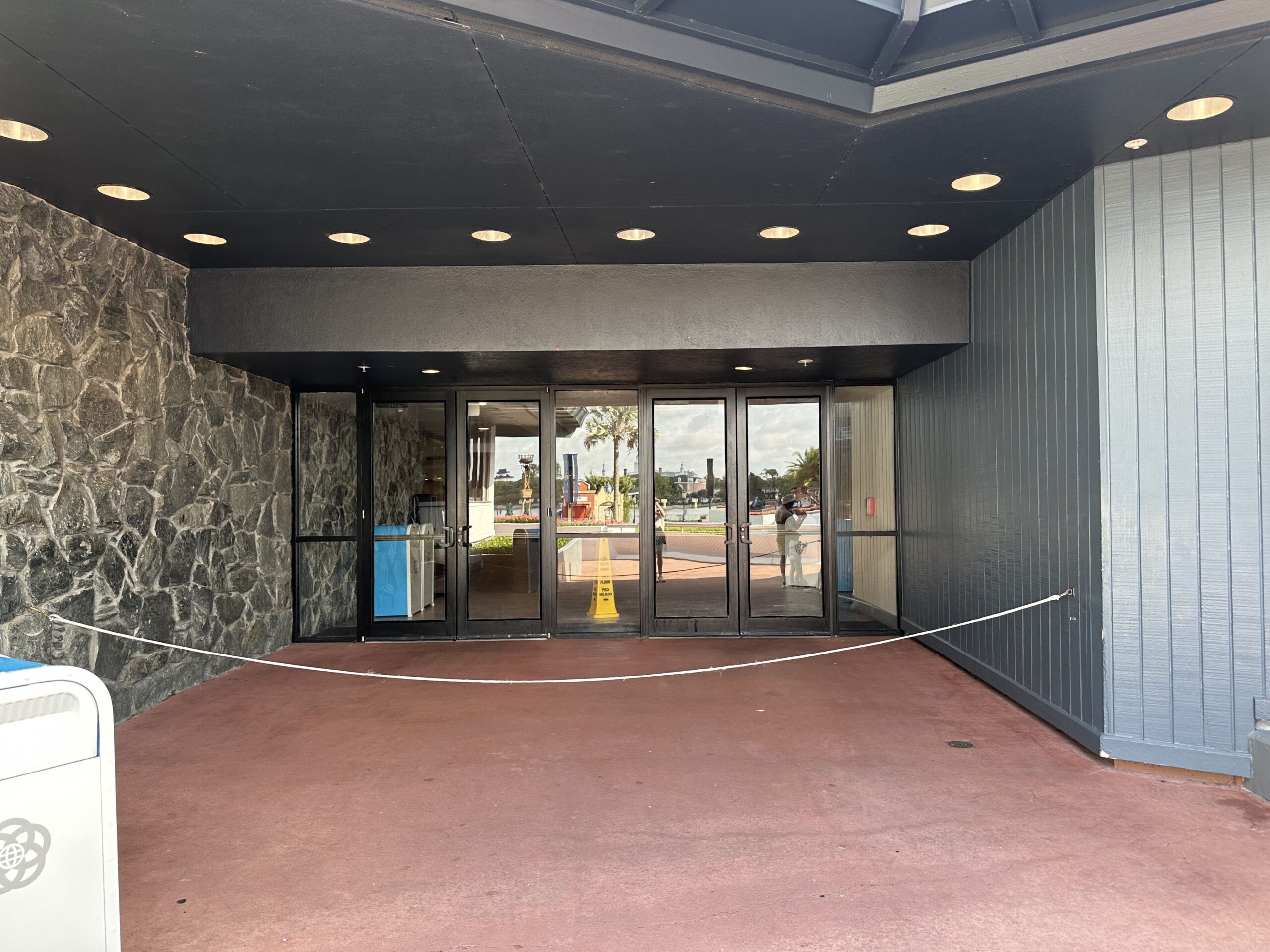 The main entrance on the far left side has no decals on the windowed doorways.