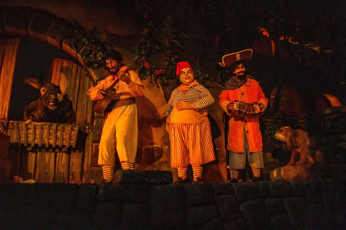 Three pirates and a donkey in the Pirates of the Caribbean ride.