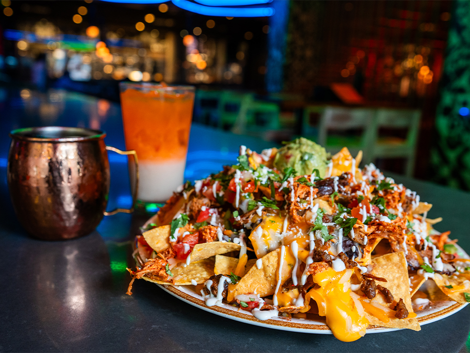 No. 10 cocktail, El Golazo drink, and Hat Trick Nachos.